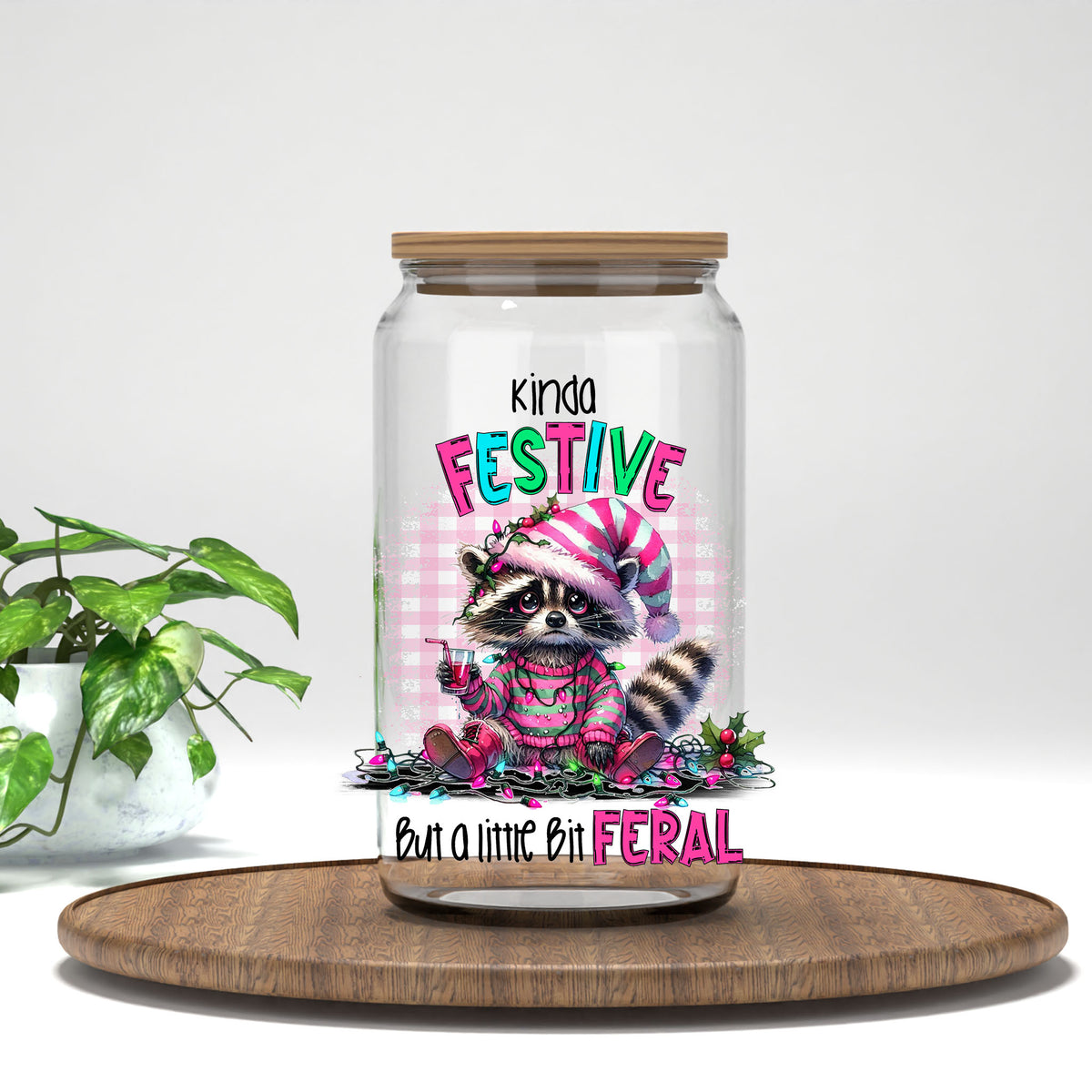 Kinda Festive But a Little Bit Feral UV DTF transfer on a clear glass can