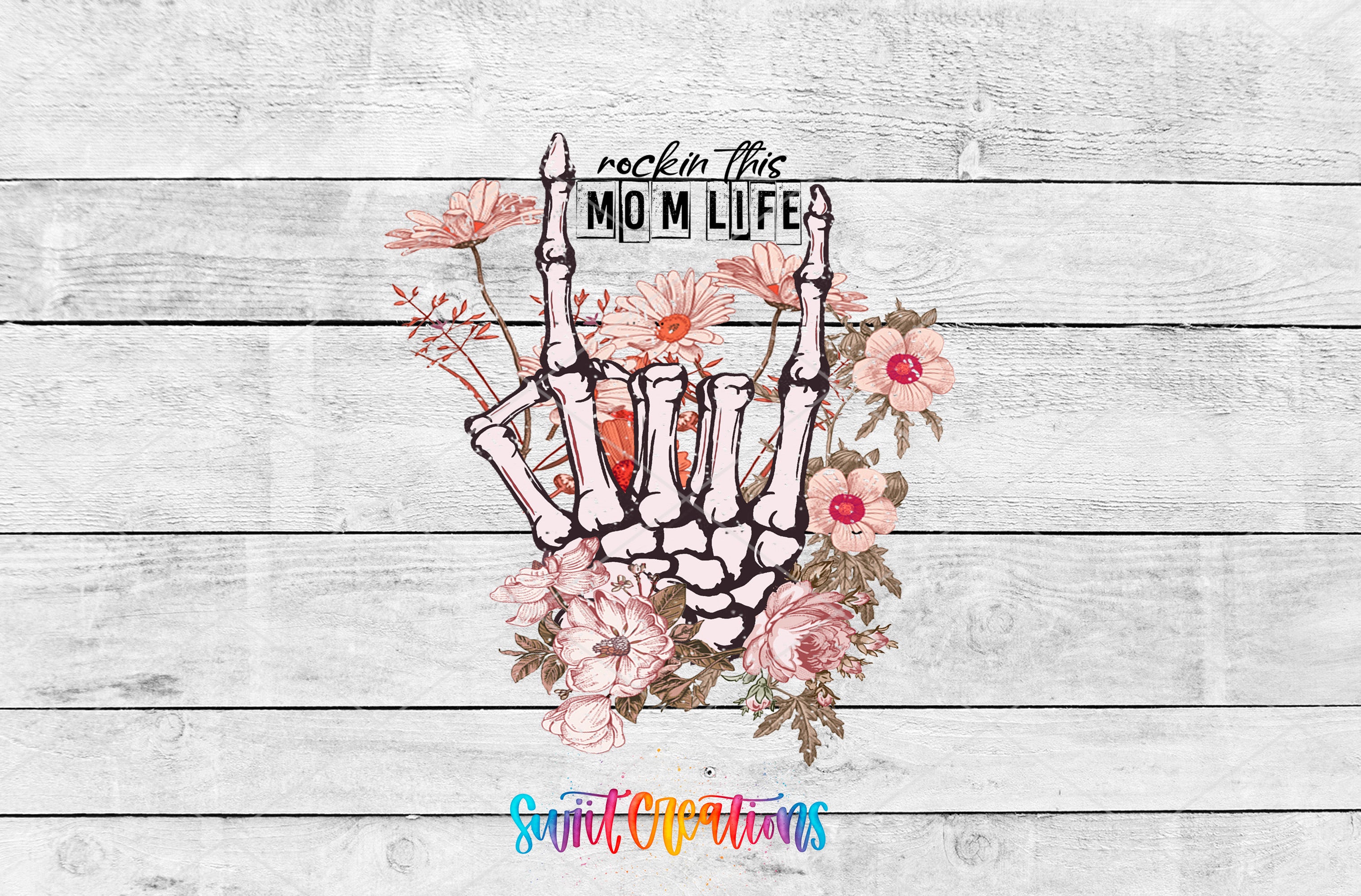 A hand-drawn skeleton hand holding a flower, with the text "rockin this MOM LIFE" written above it.