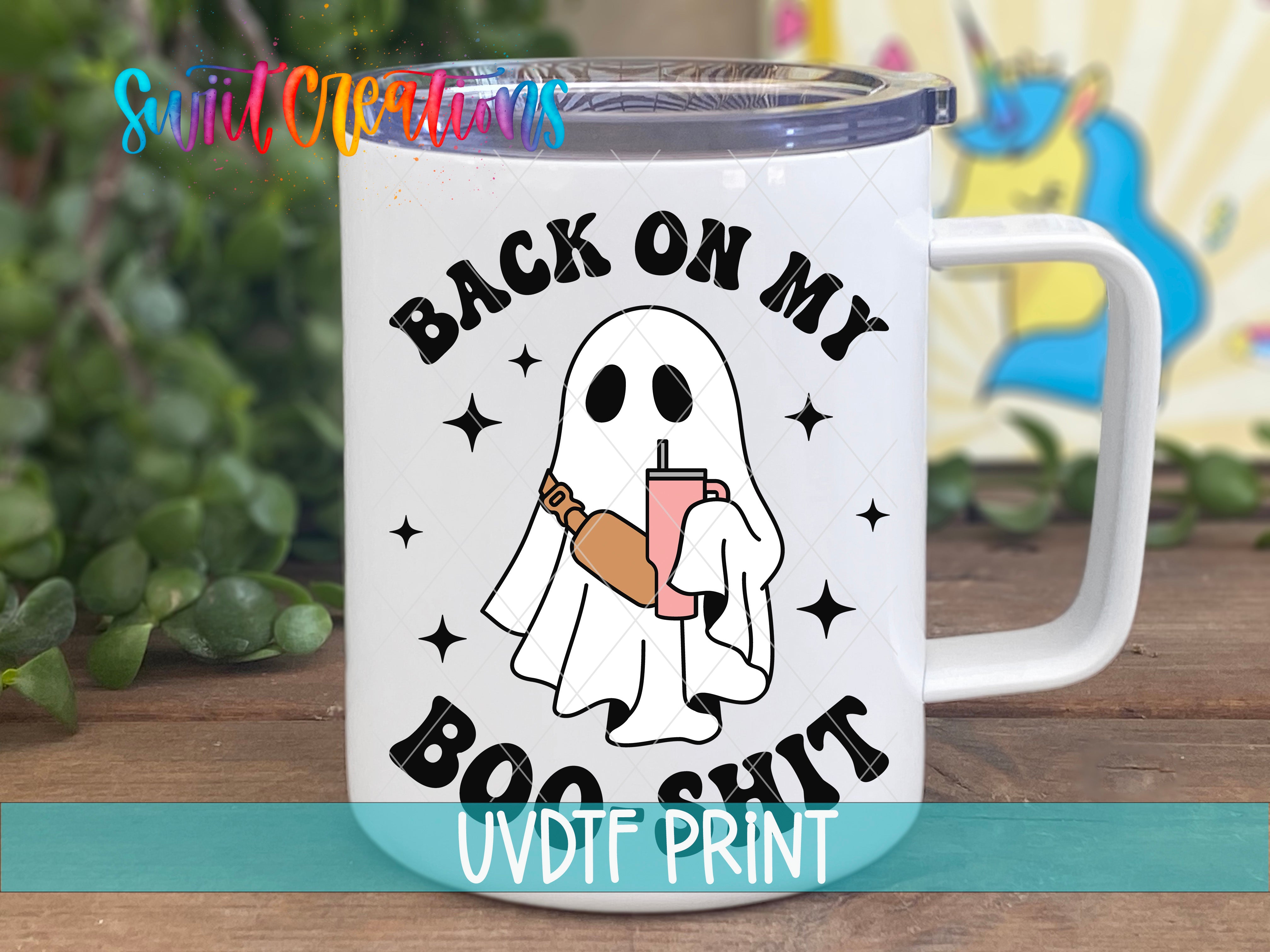 a white coffee mug with a ghost holding a drink
