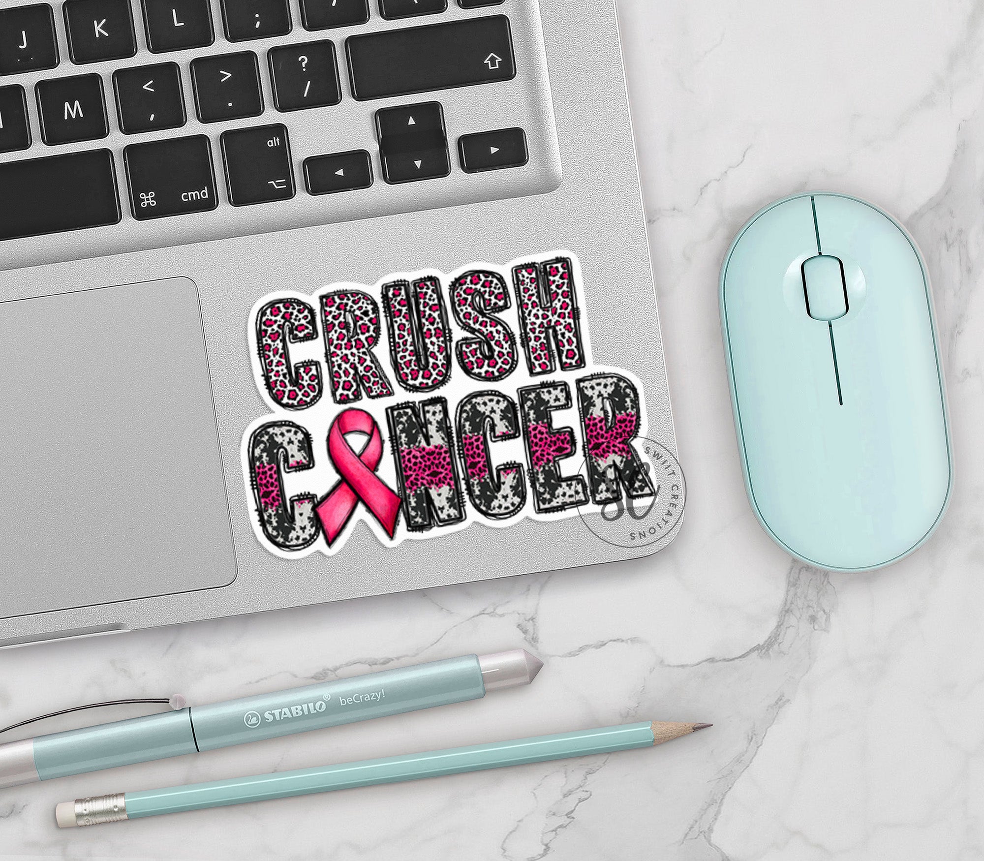 a laptop with a sticker that says crush cancer