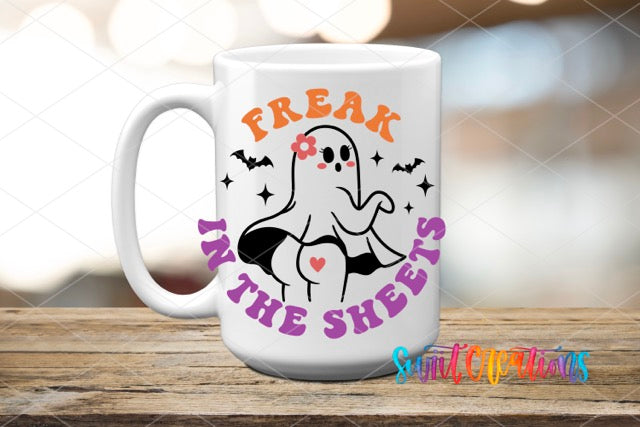 a white coffee mug with the words freak in the sheets on it