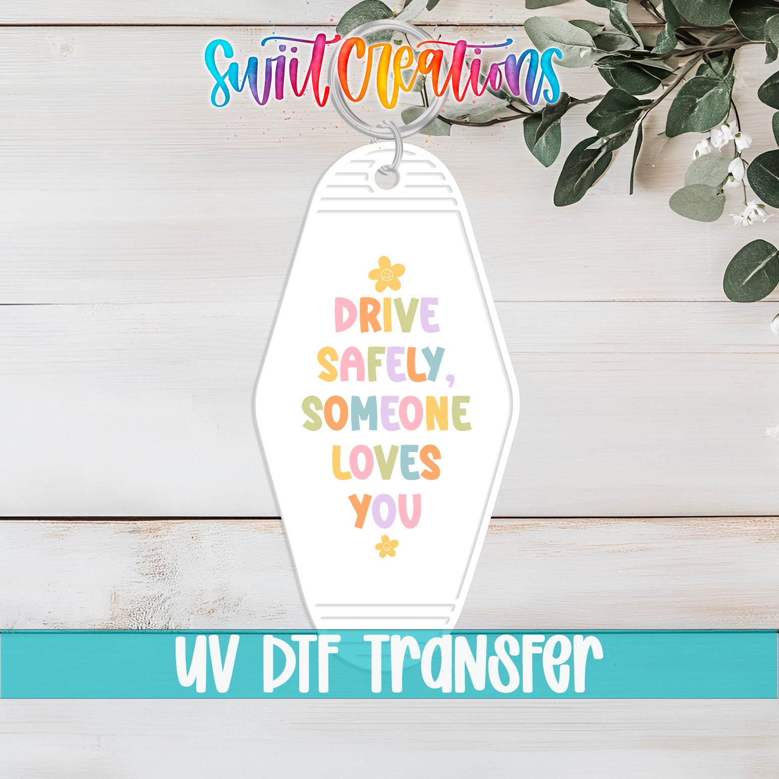A keychain with a message that says "DRIVE SAFELY, SOMEONE LOVES YOU" in a colorful, playful font.