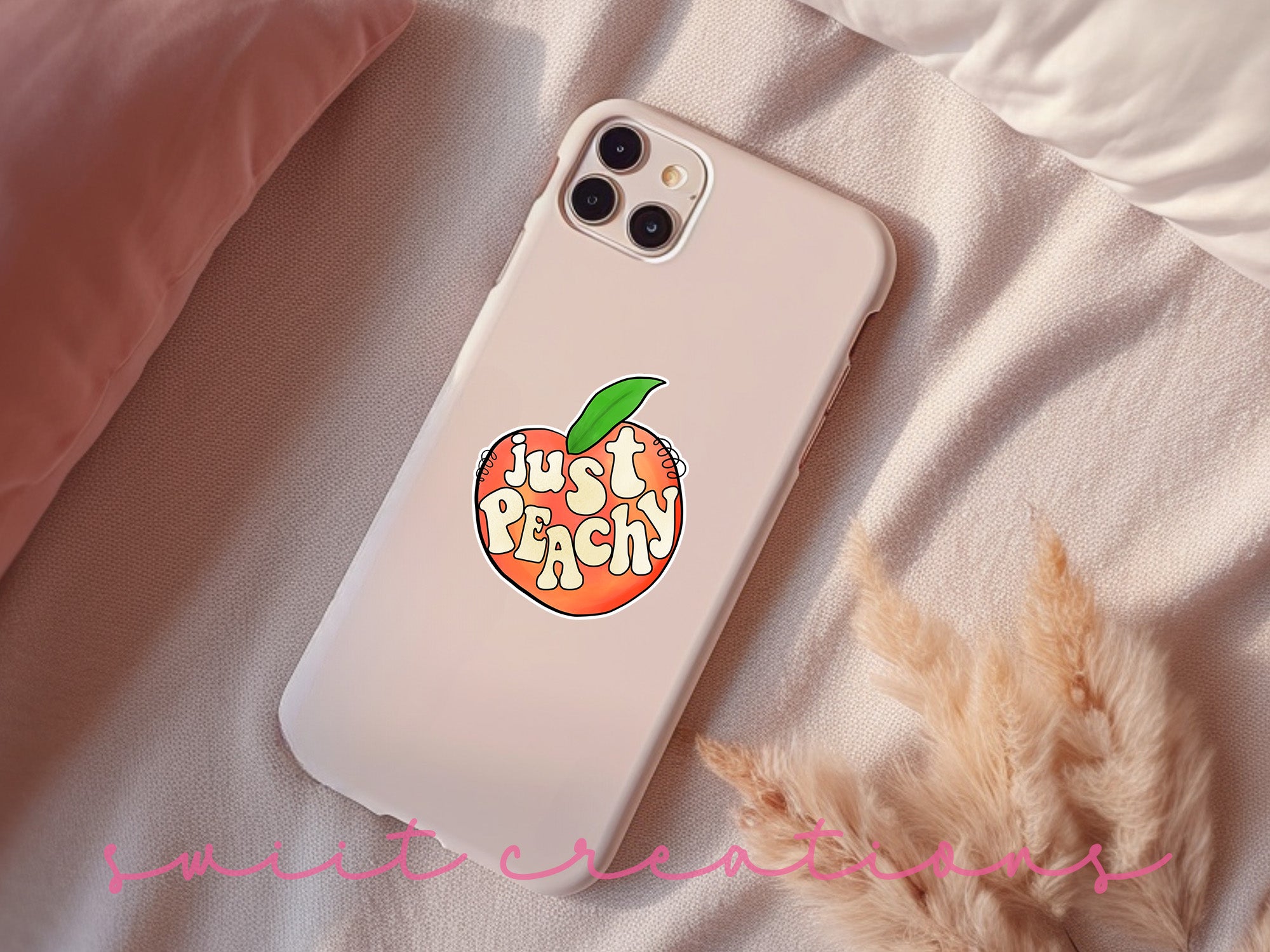 a phone case with a sticker of a peach on it
