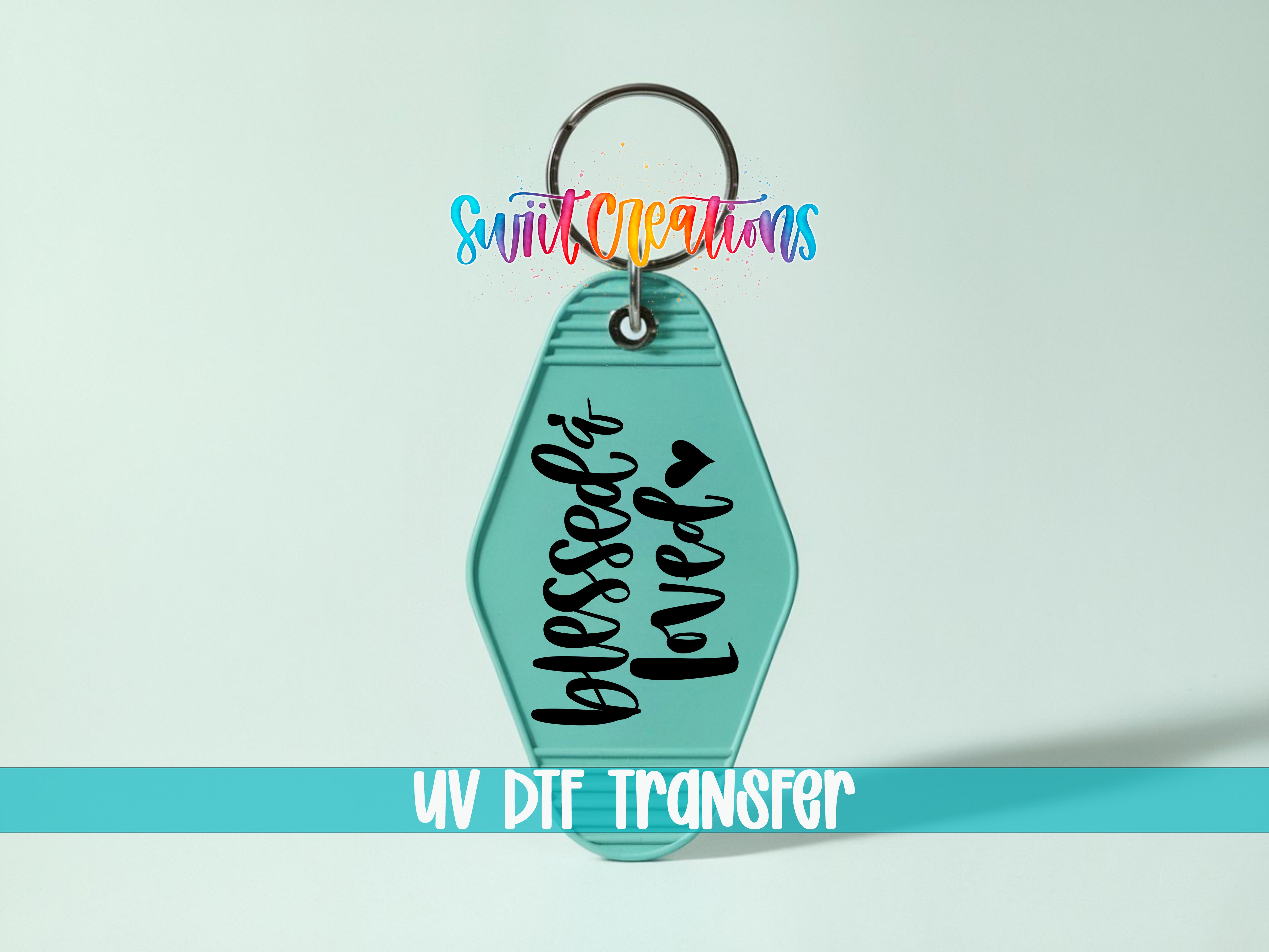 A keychain with a teal color and the text "Blessed loved" printed on it.