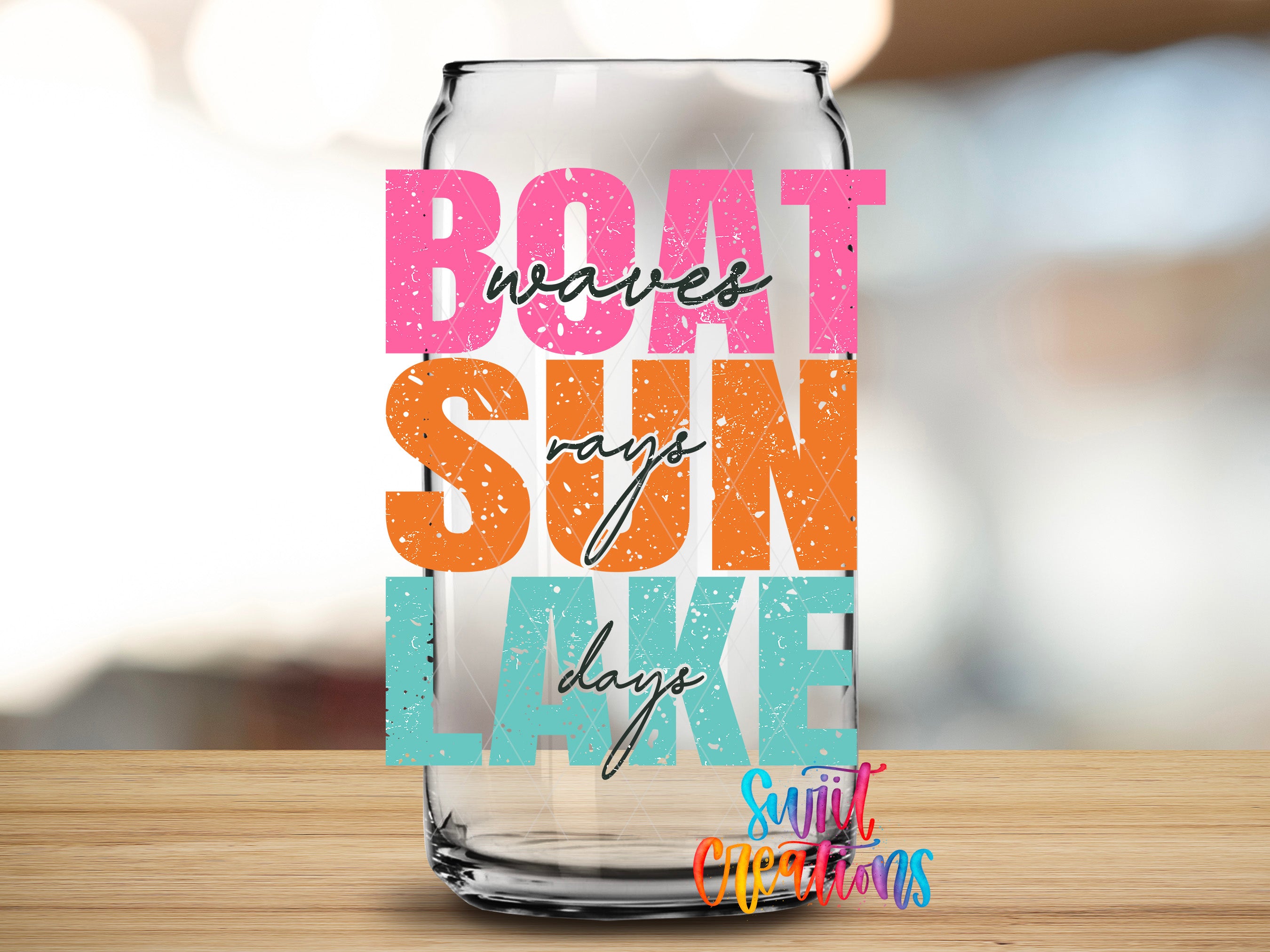 a glass can with text on it, placed on a wooden surface.