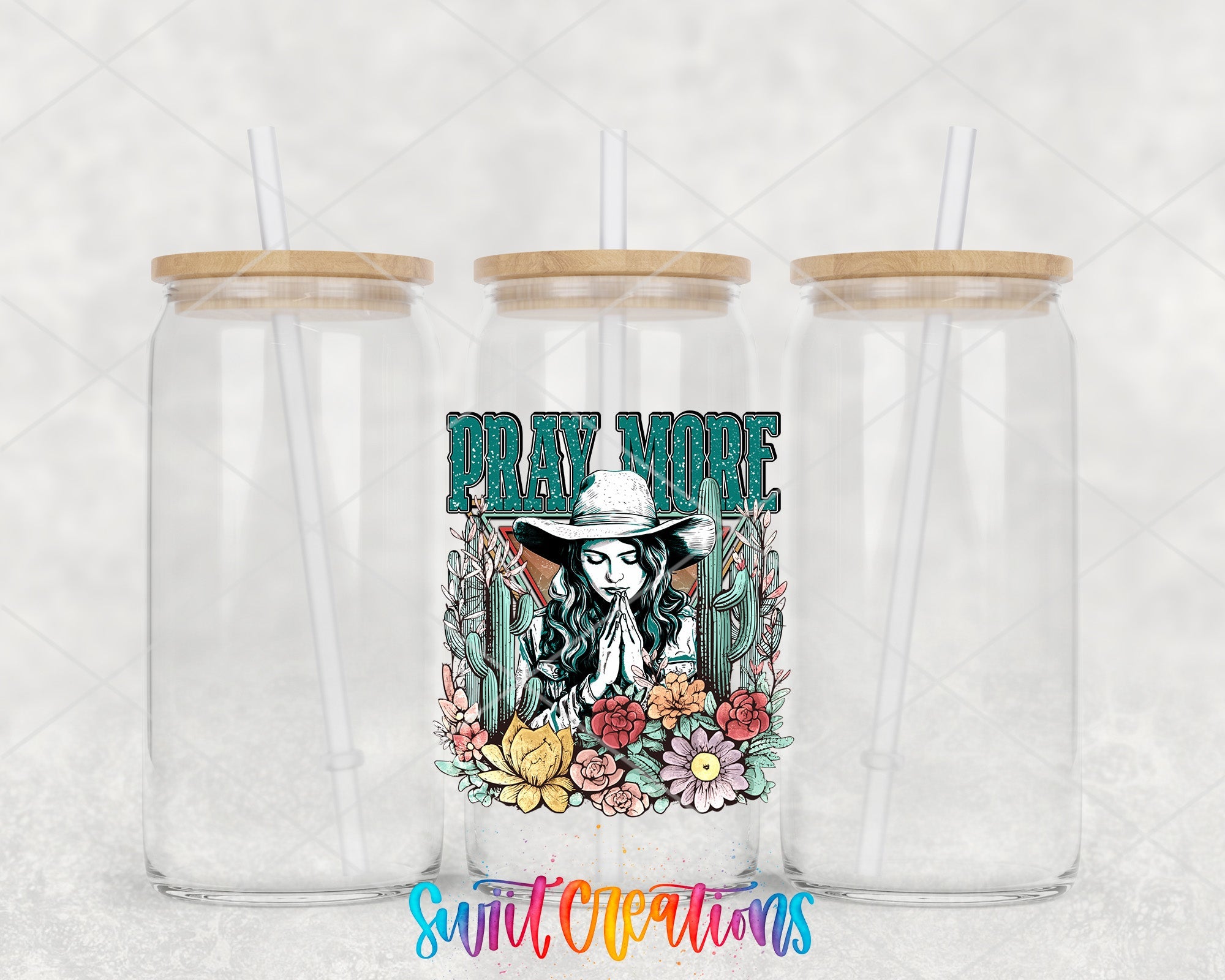 two clear tumblers with a cowboy design on them