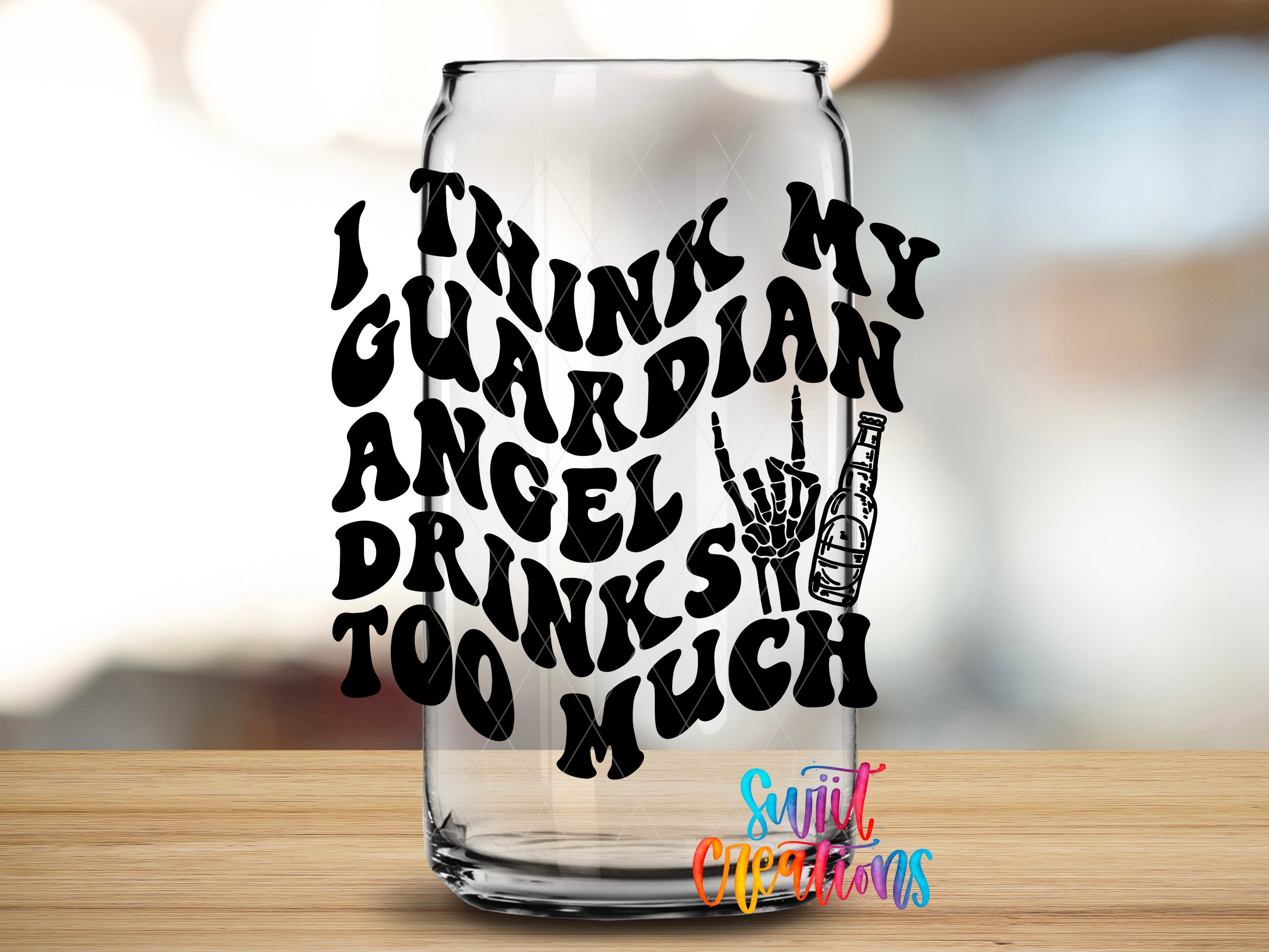 A glass with a hand-drawn text design on it, which appears to be a humorous or playful message.