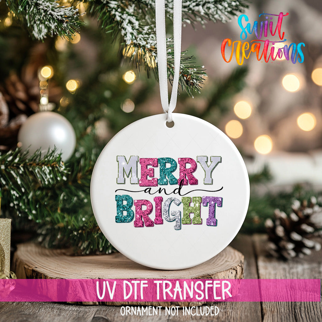 A white ceramic ornament with the text "MERRY and BRIGHT" in colorful letters hangs on a Christmas tree.