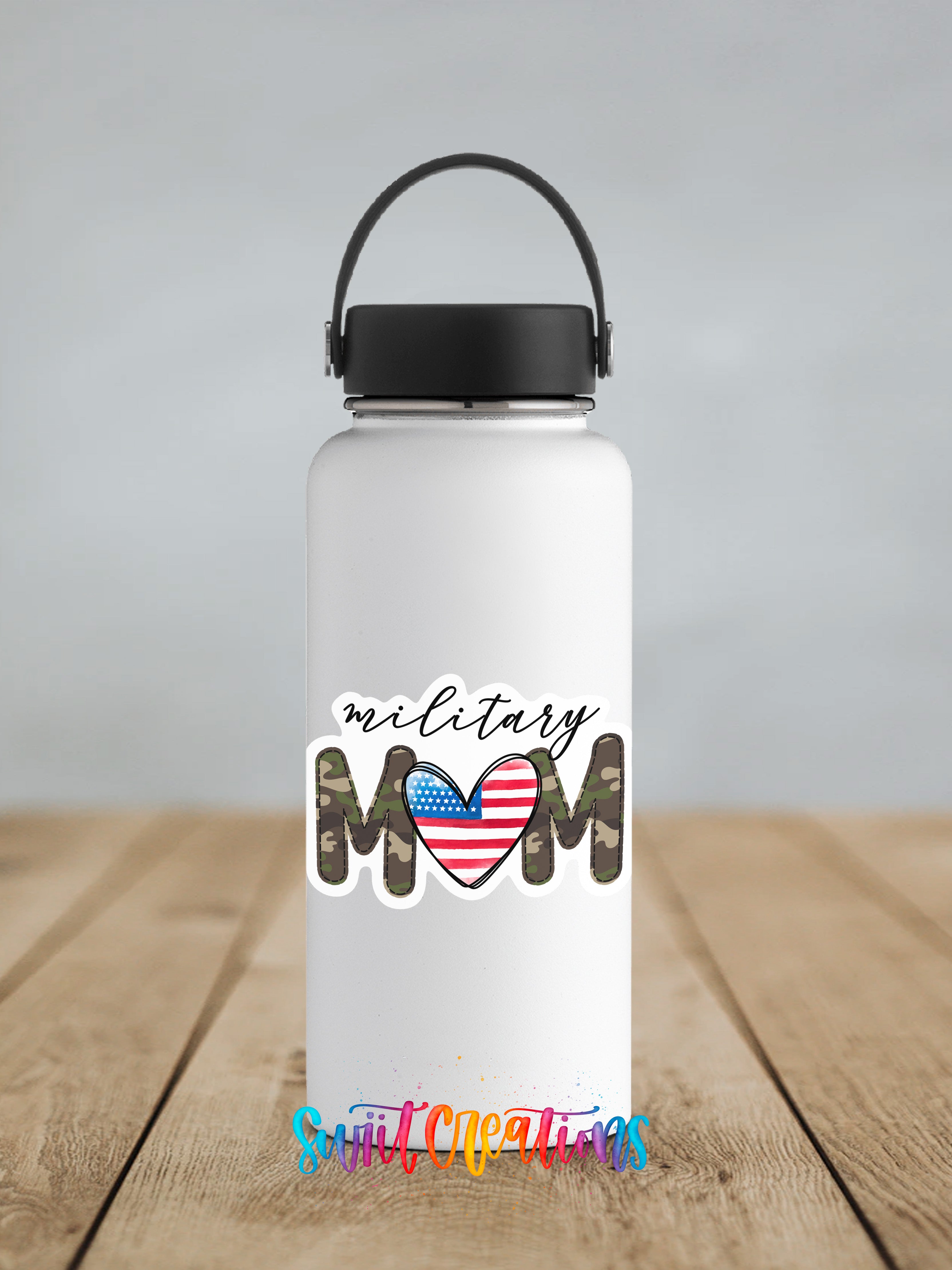 A white water bottle with a black handle and a sticker that says "military mom" in a stylized font, featuring an American flag design.