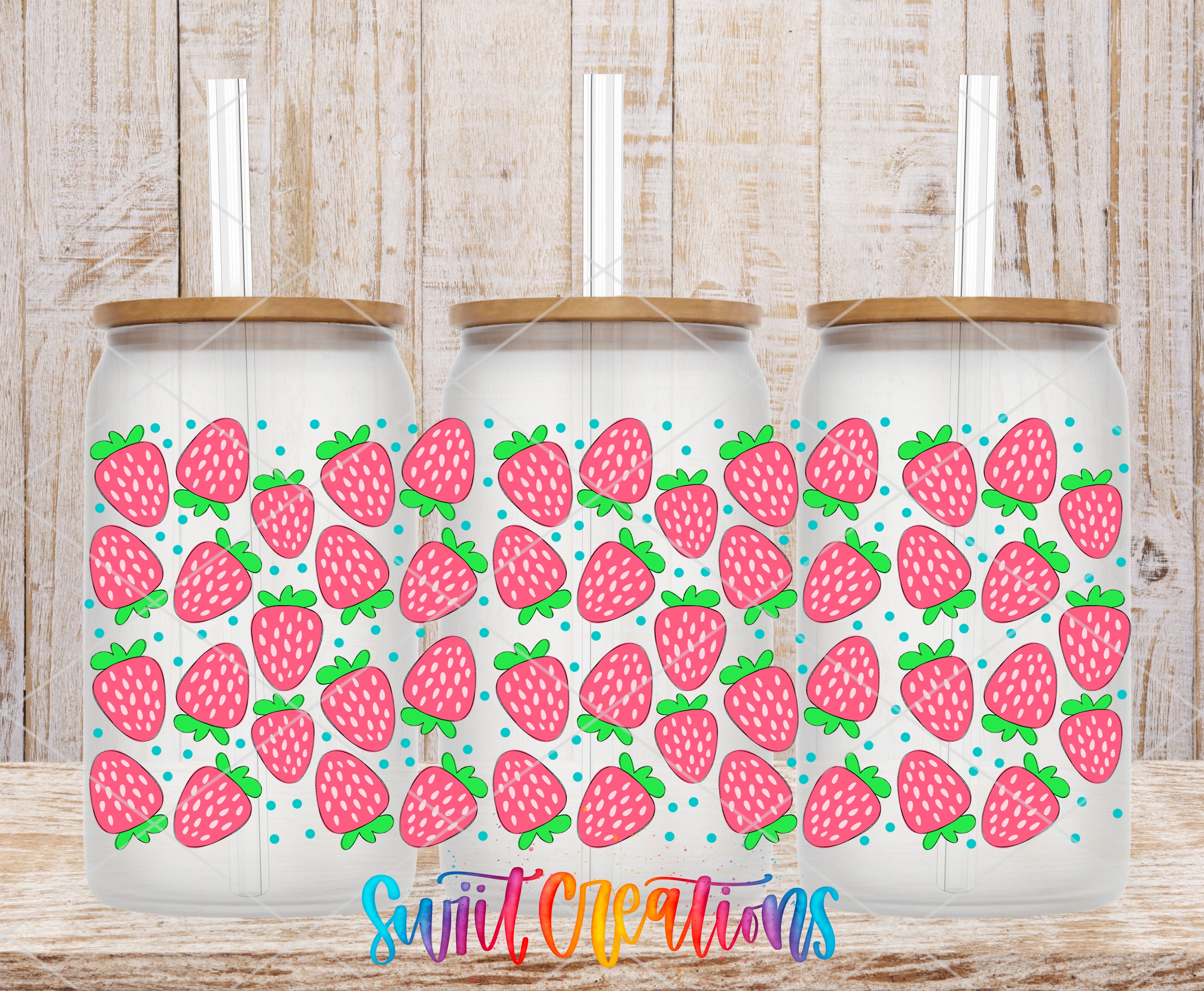 Three glass jars with lids, each decorated with a pattern of pink strawberries and green leaves.