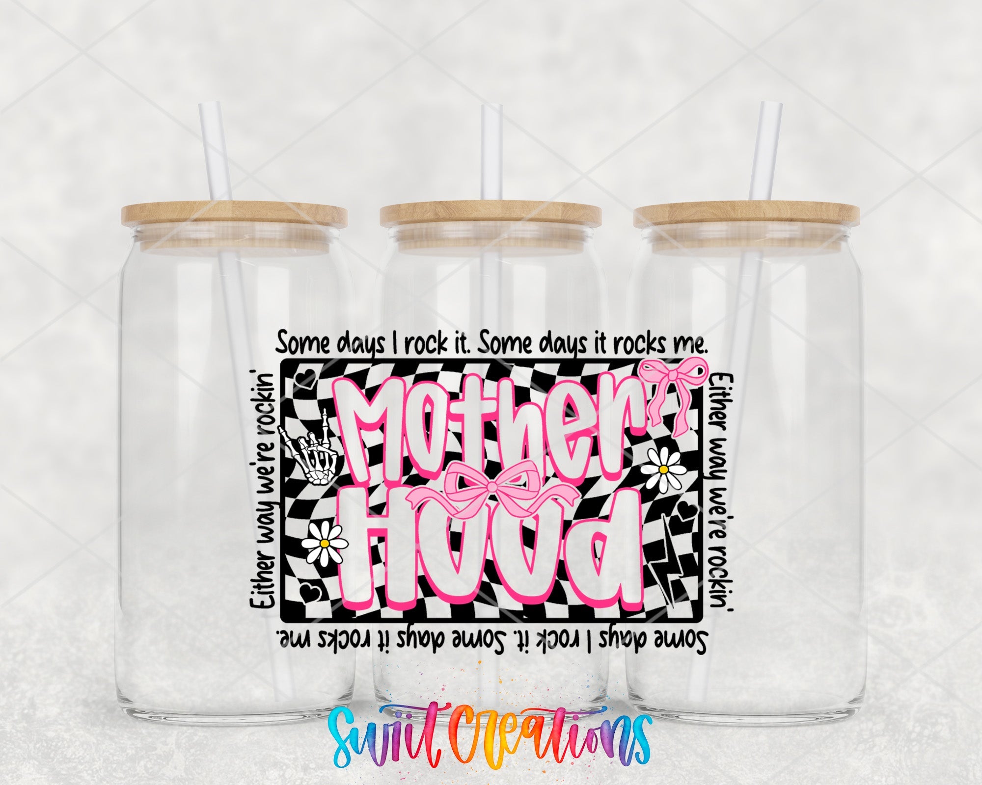 two clear tumblers with pink and black designs on them