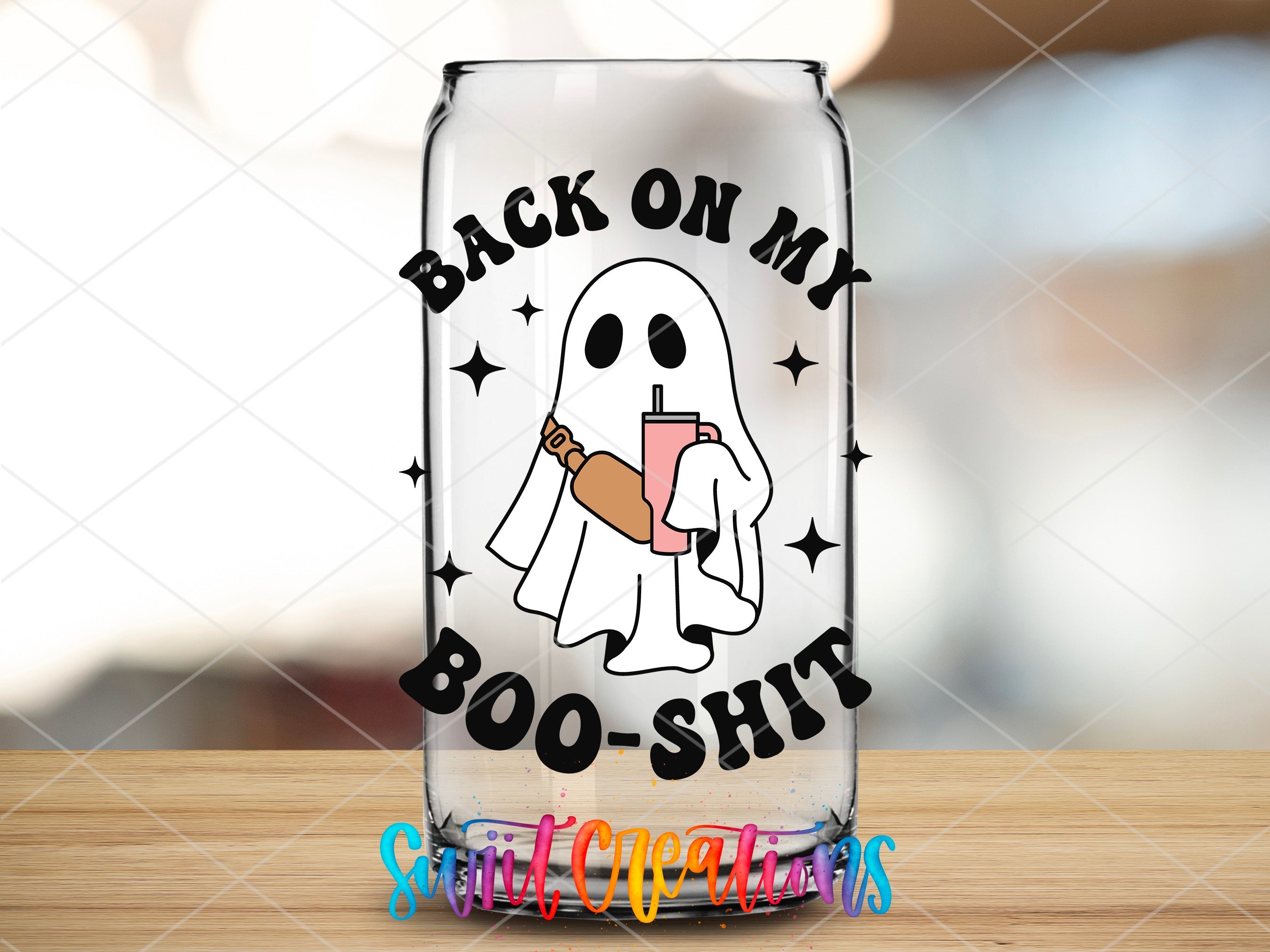 a glass with a ghost holding a drink