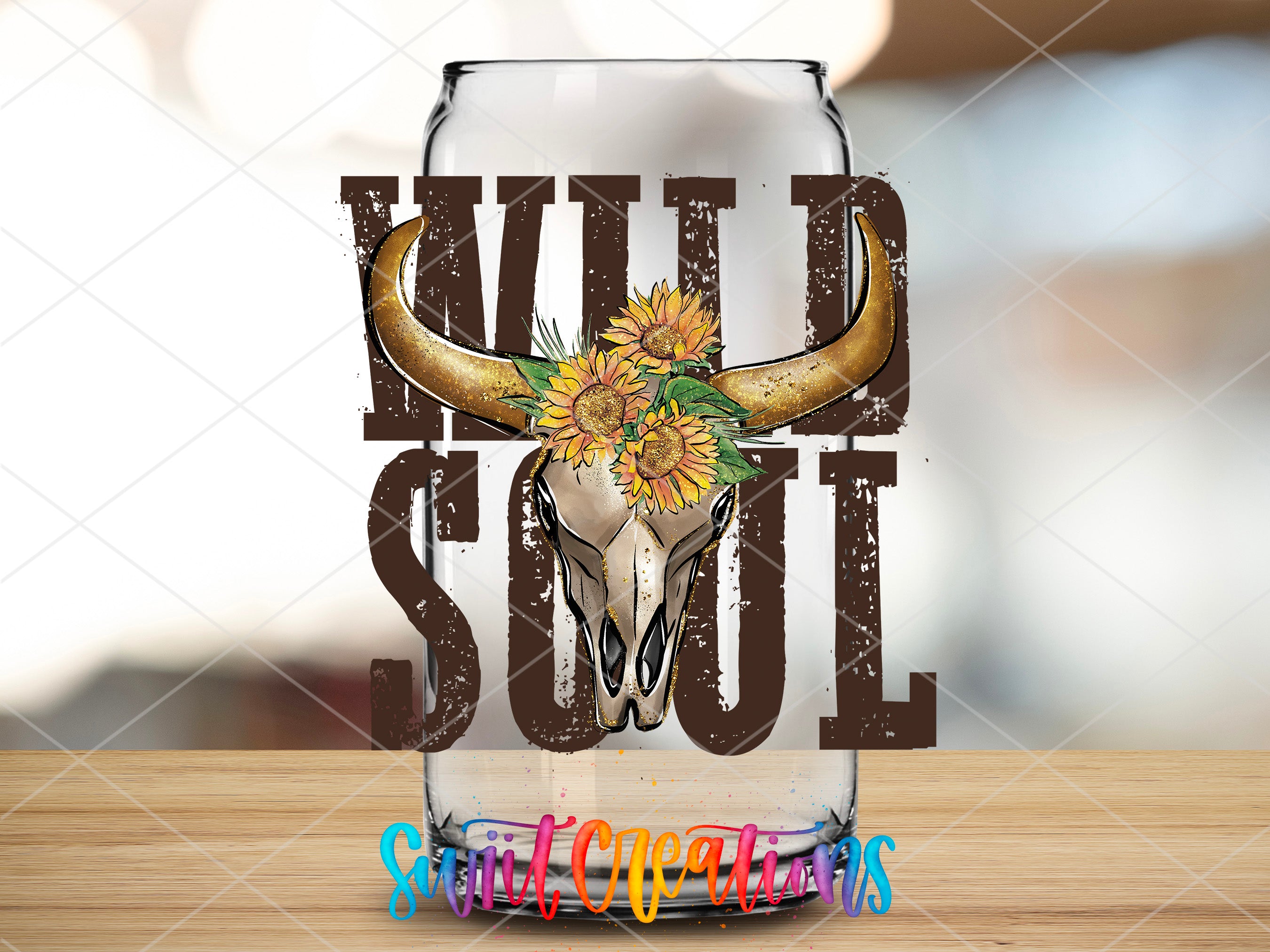 a glass with a cow skull and sunflowers on it