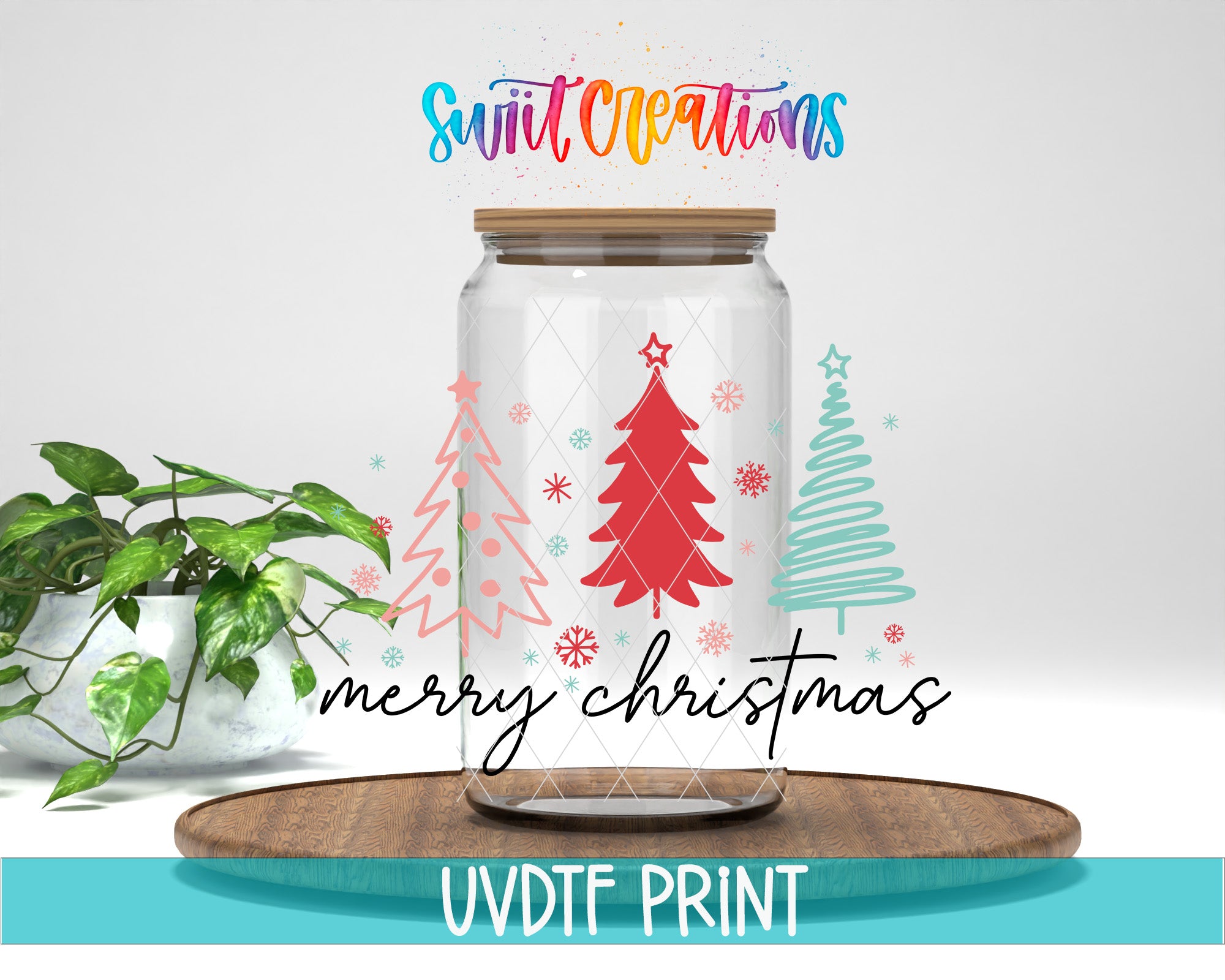 A glass jar with a lid, decorated with Christmas trees and snowflakes, sits on a wooden surface. The jar is surrounded by a potted plant and a wooden tray. The text "Merry Christmas" is written on the jar, and the phrase "UVDF PRINT" is written at the bottom of the image.