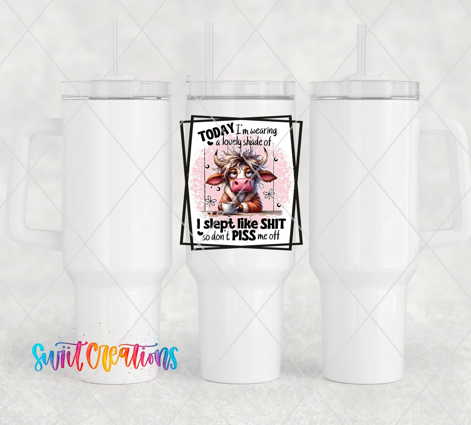 a white cup with a picture of a cow on it
