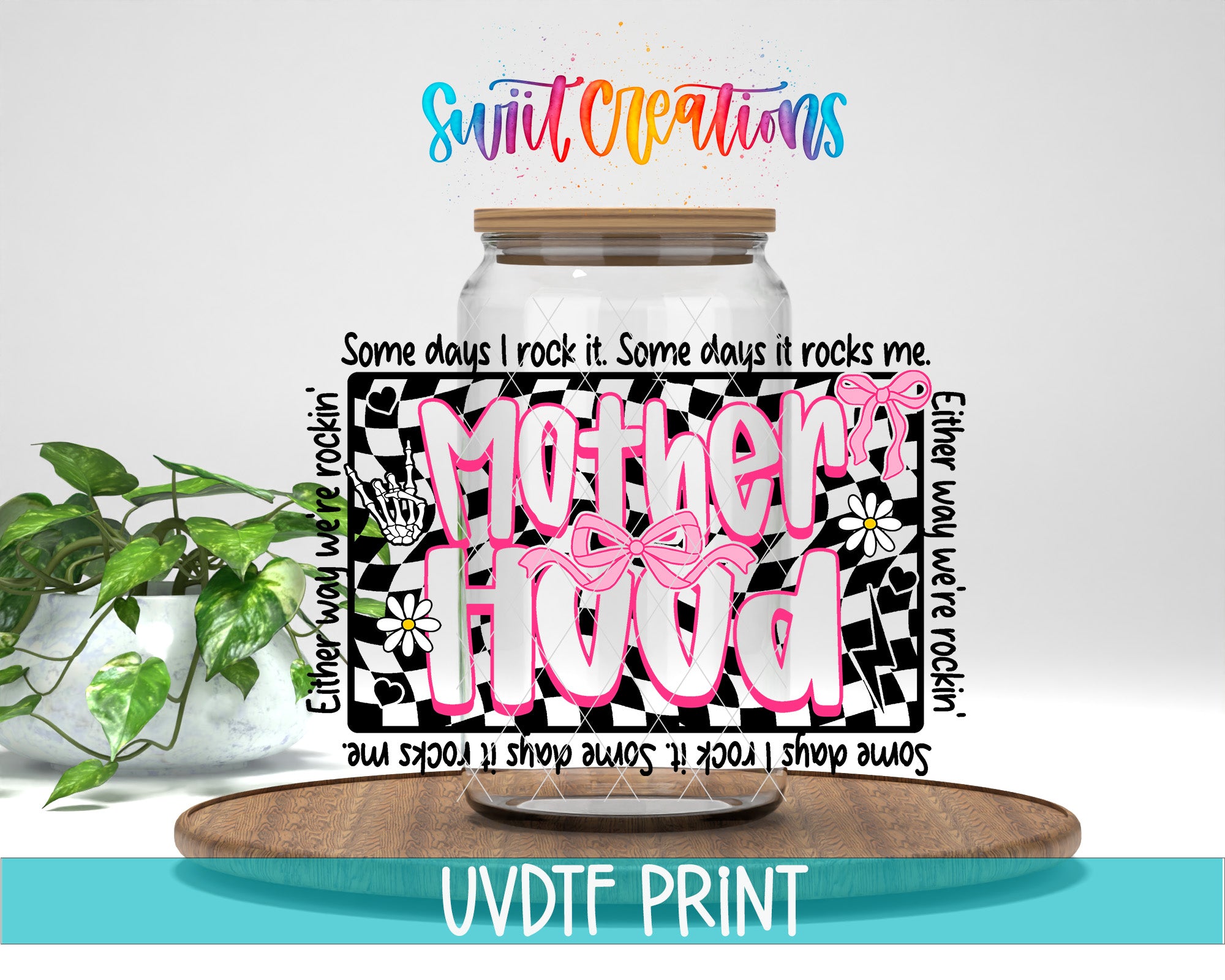 a glass jar with a decorative label that says "Mother Hood" in pink and black text, placed on a wooden surface. There is also a potted plant in the background.