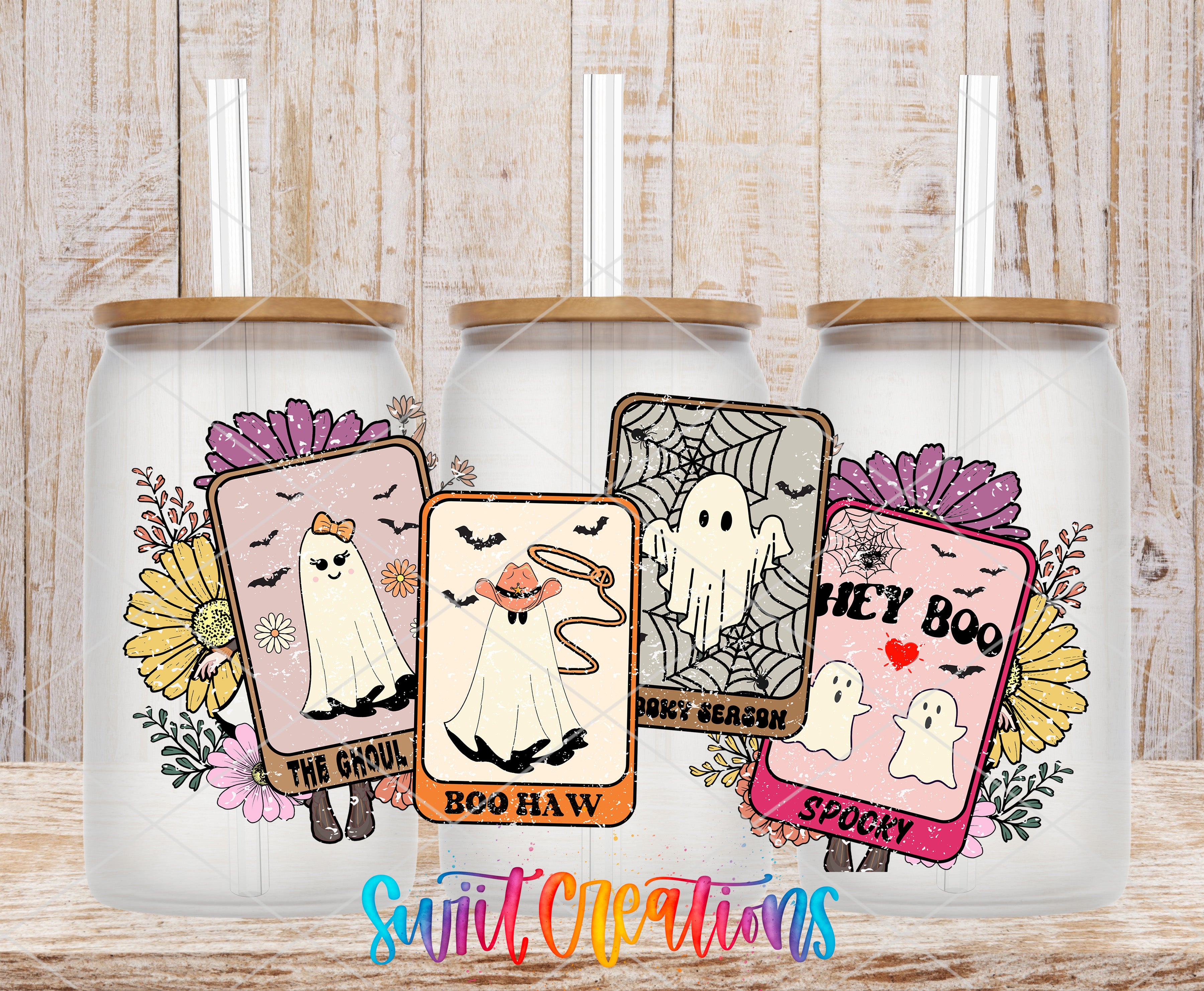 three glass tumblers with Halloween-themed labels, including "The Groul", "Boo Haw", and "Spooky", each with a straw.