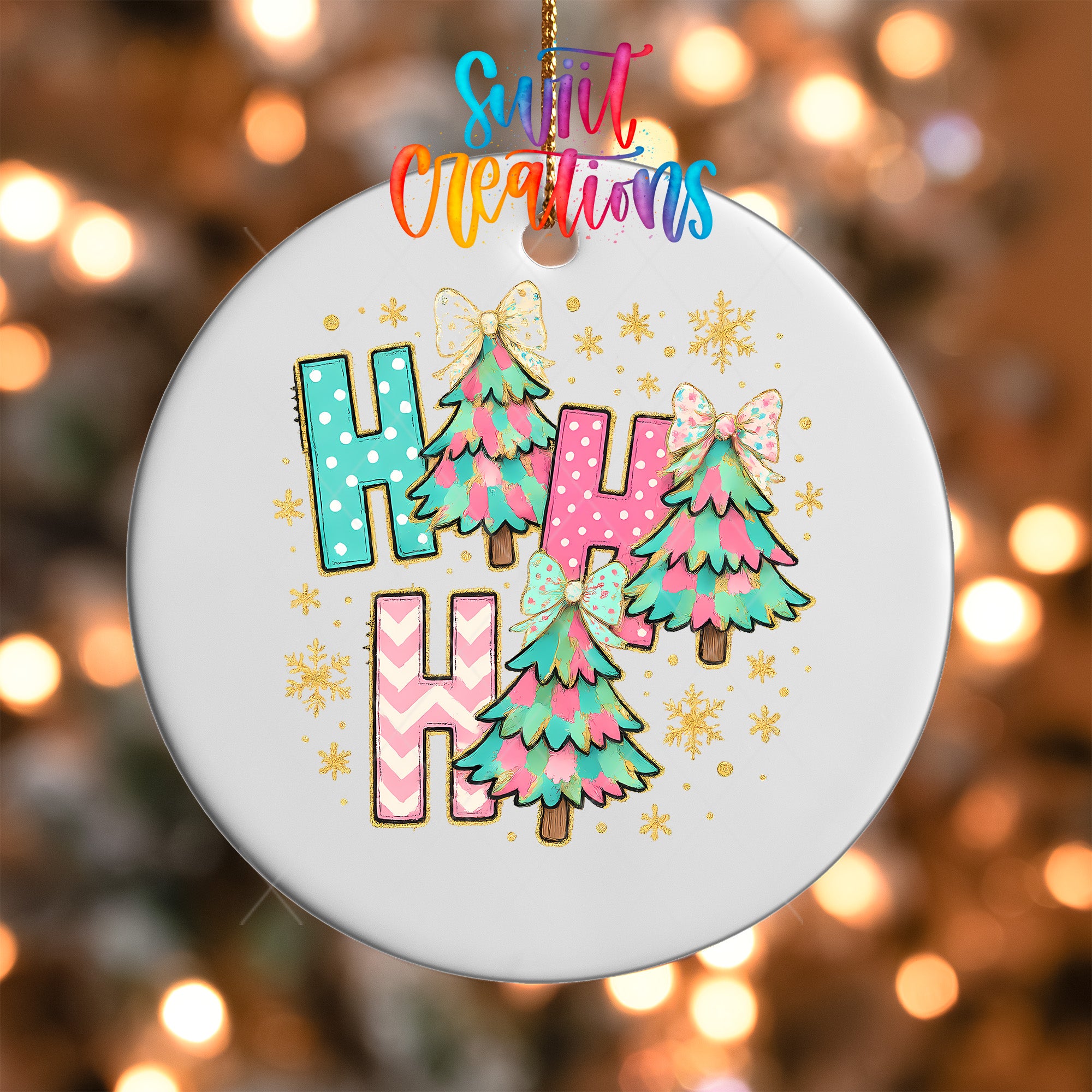 A white ornament with colorful Christmas trees and snowflakes, along with the text "Hahaha" in a playful font.