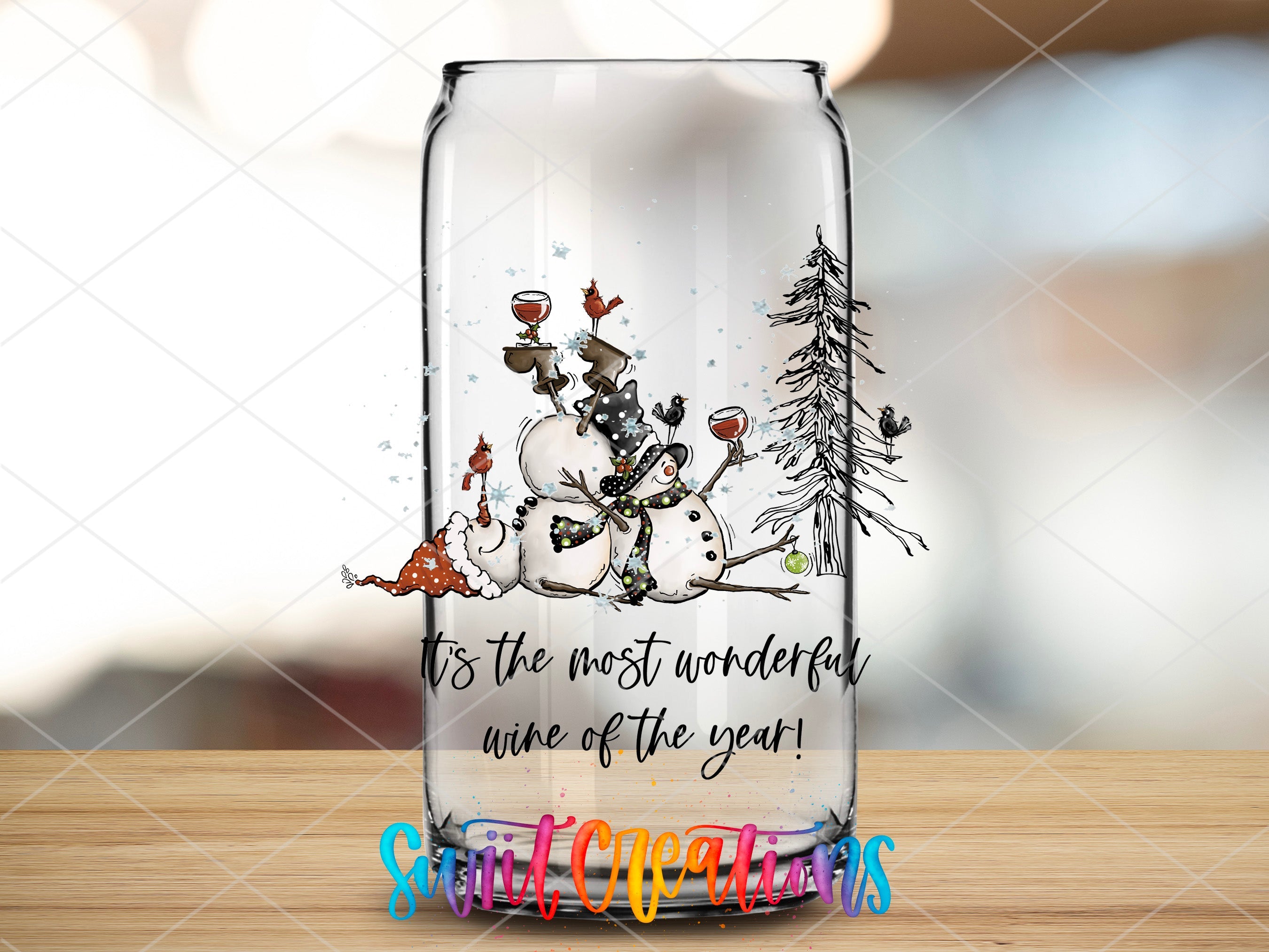 a glass with a picture of a snowman on it