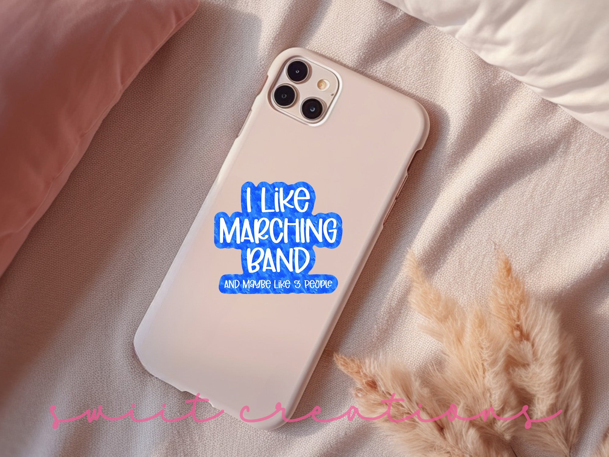 a white phone case with a blue sticker on it