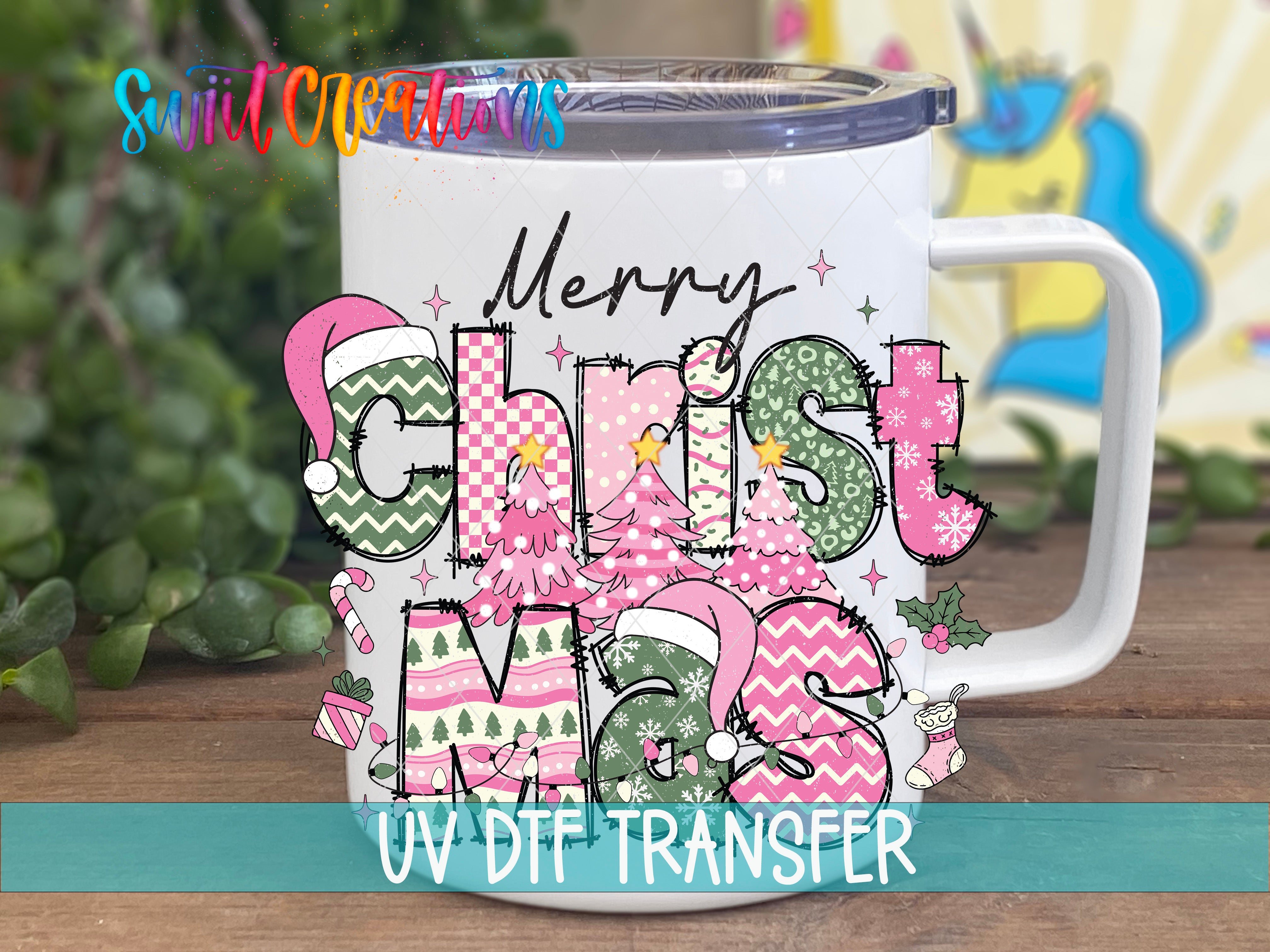 A white mug with a colorful Christmas-themed design, including the text "Merry Christmas" and various Christmas-related elements such as trees, stars, and snowflakes.
