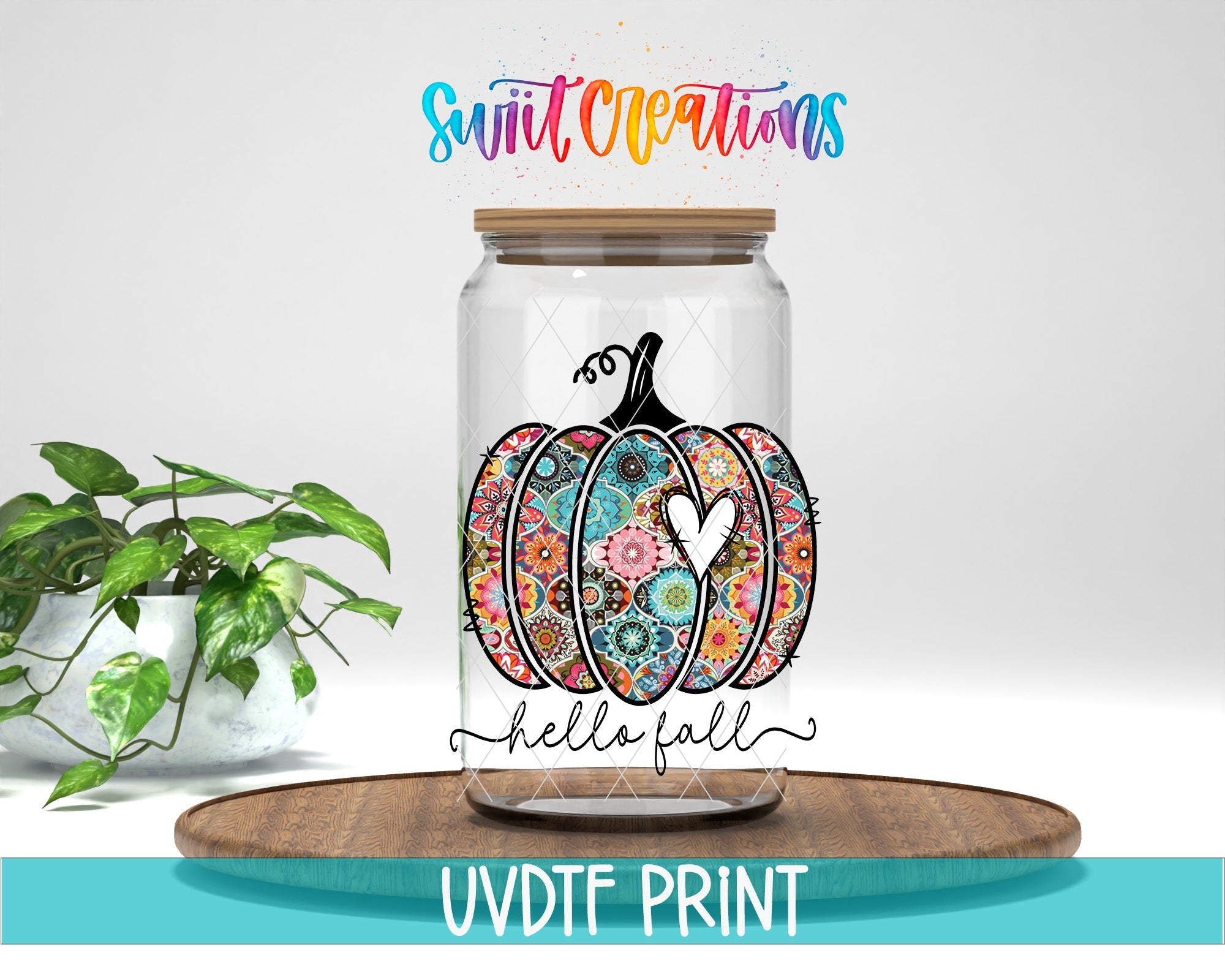 a glass jar with a painted pumpkin on it
