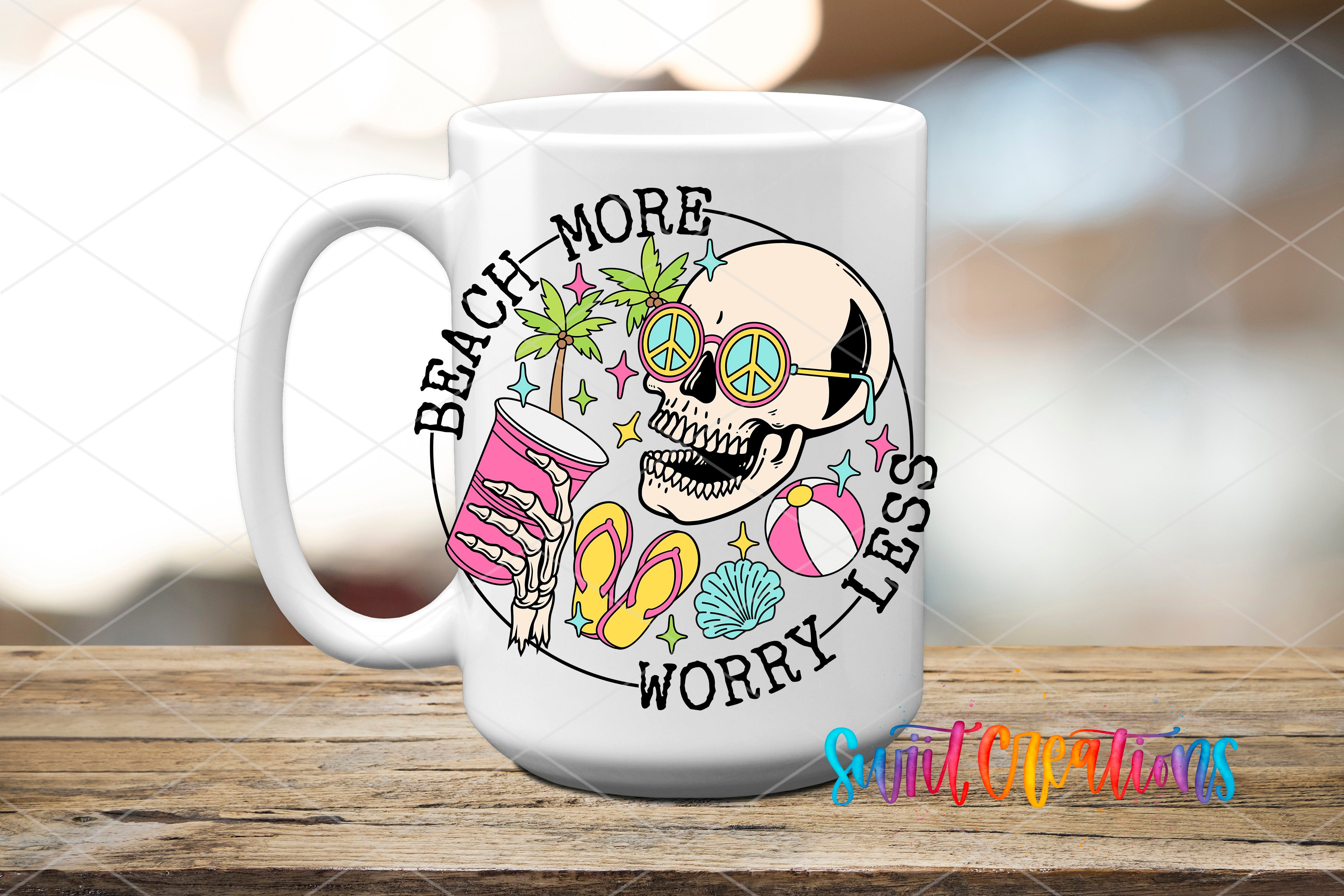 A white mug with a colorful design featuring a skull, sunglasses, beach-themed objects, and the text "BEACH MORE WORRY LESS"
