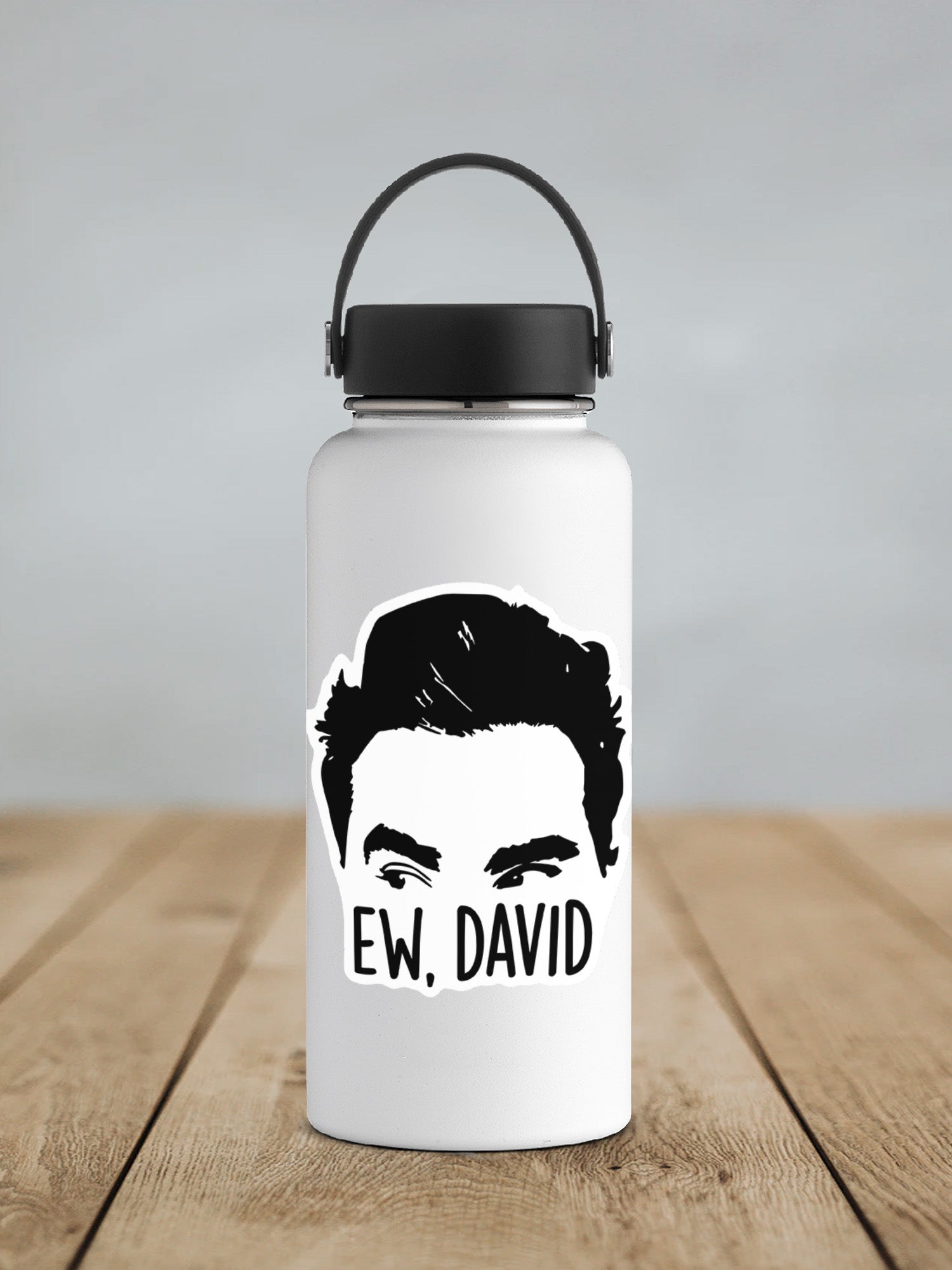 a water bottle with a picture of a man's face on it