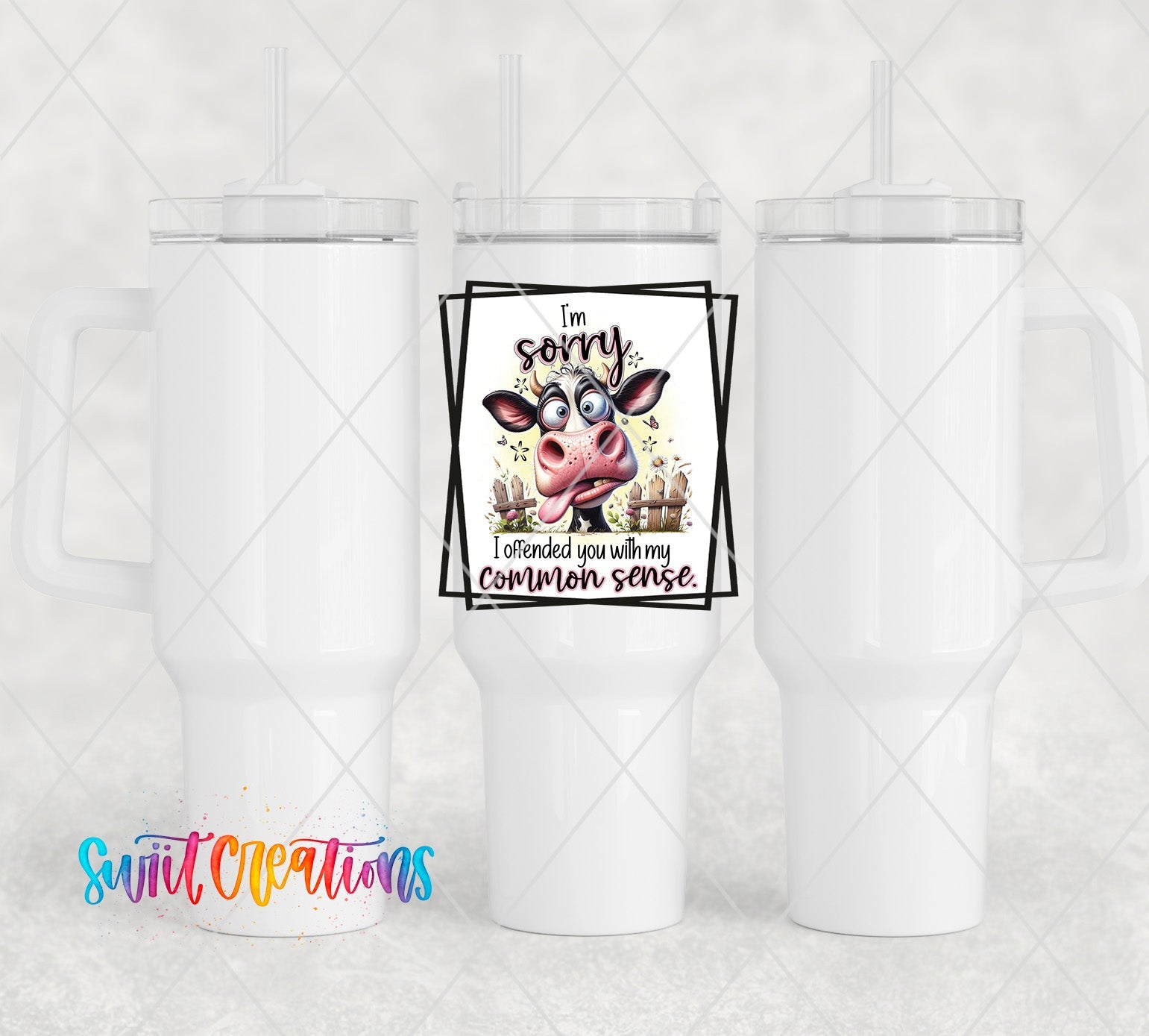 a white cup with a picture of a cow on it