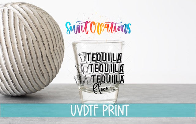a ball of yarn next to a glass of water
