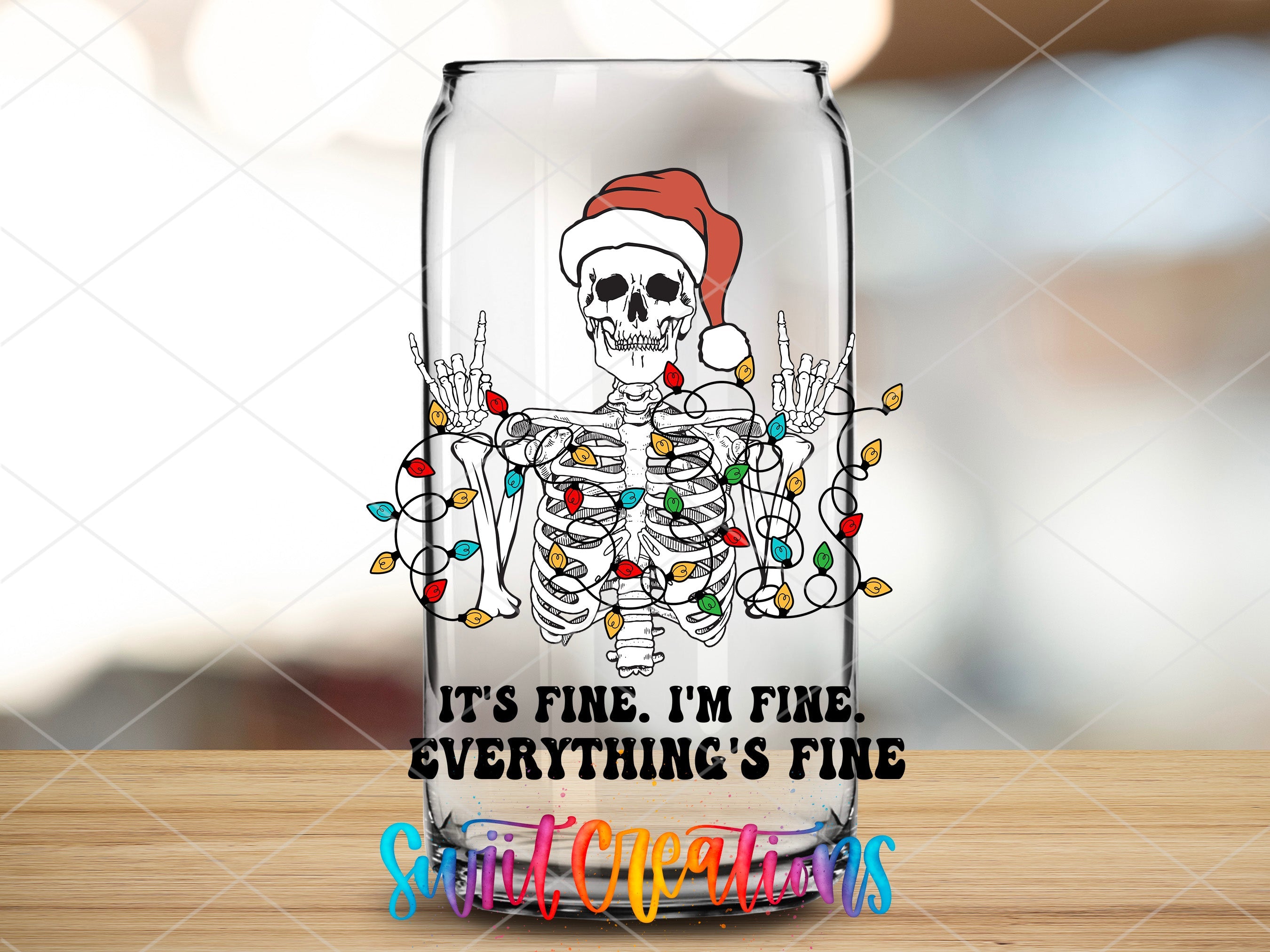 a glass with a skeleton wearing a santa hat
