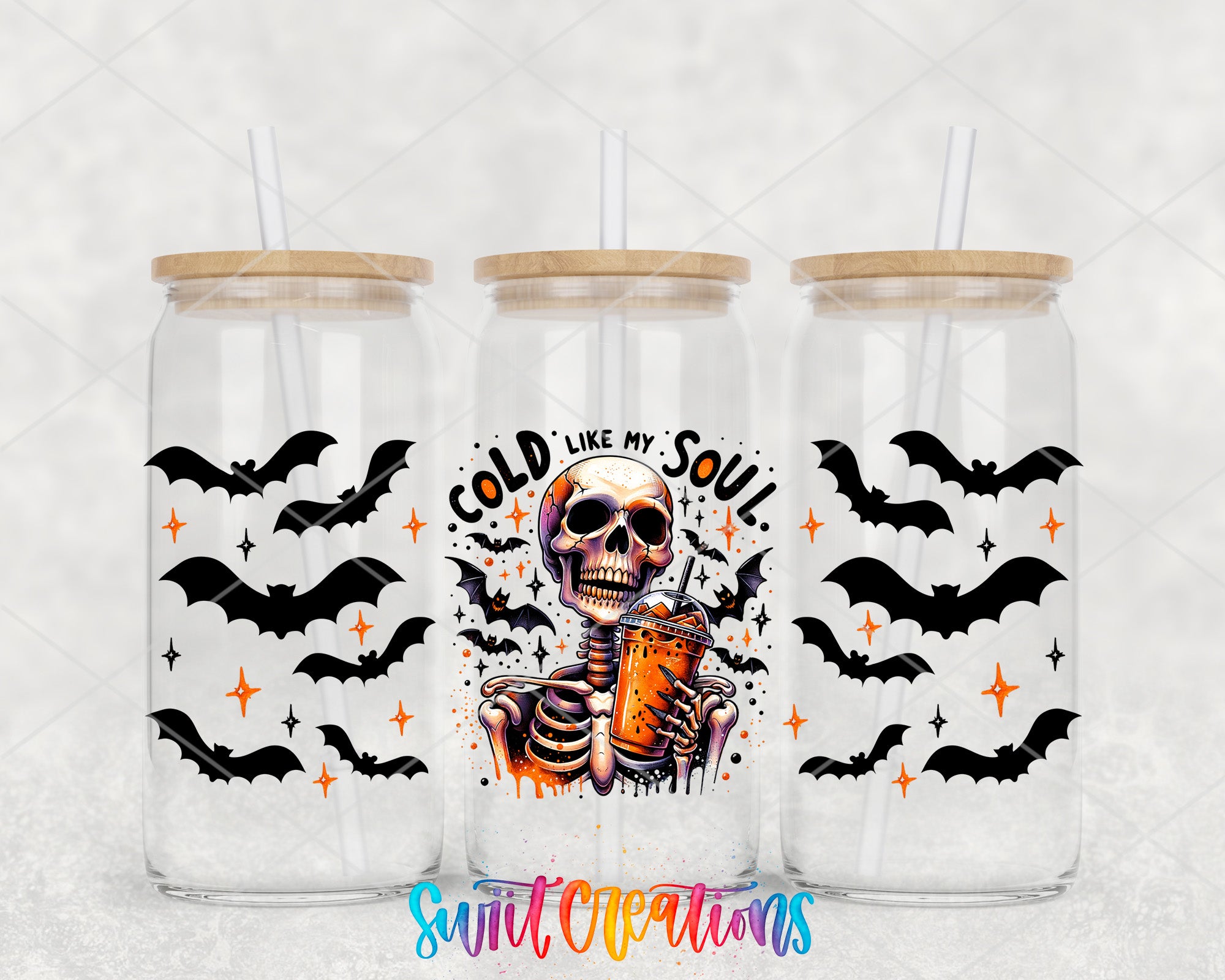 three glass tumblers with Halloween-themed designs. The tumblers have black bats and a skeleton holding a drink, with the phrase "I'M LIKE MY SOUL" written on them.