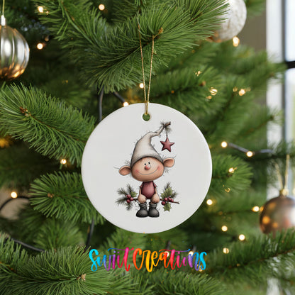 A white ceramic ornament featuring a cartoon elf wearing a hat and holding a star, hanging on a Christmas tree.