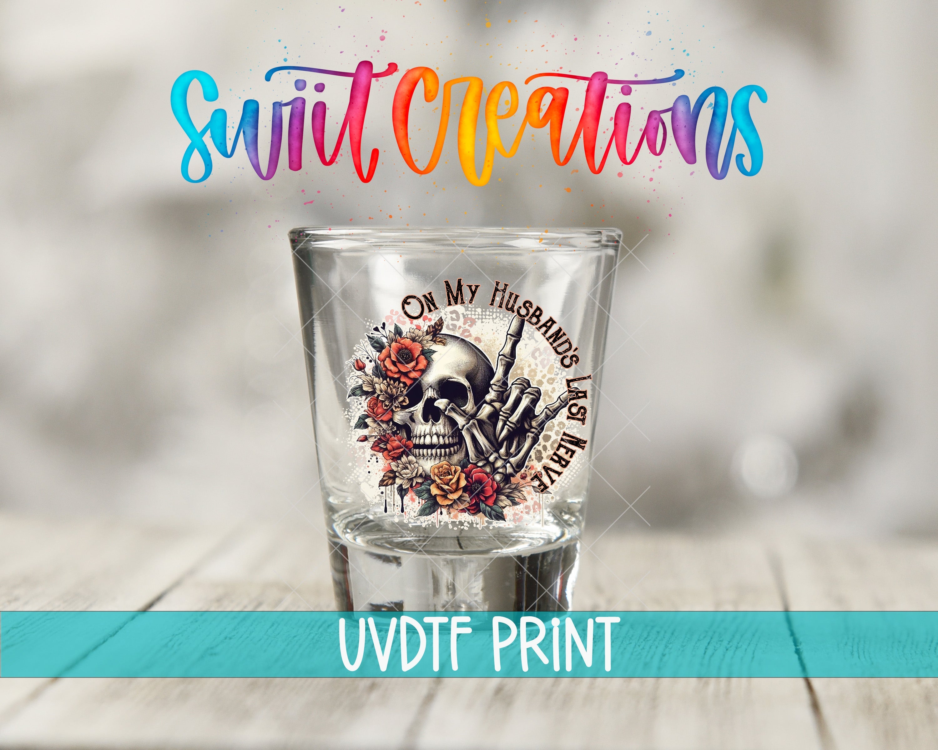 a shot glass sitting on top of a wooden table