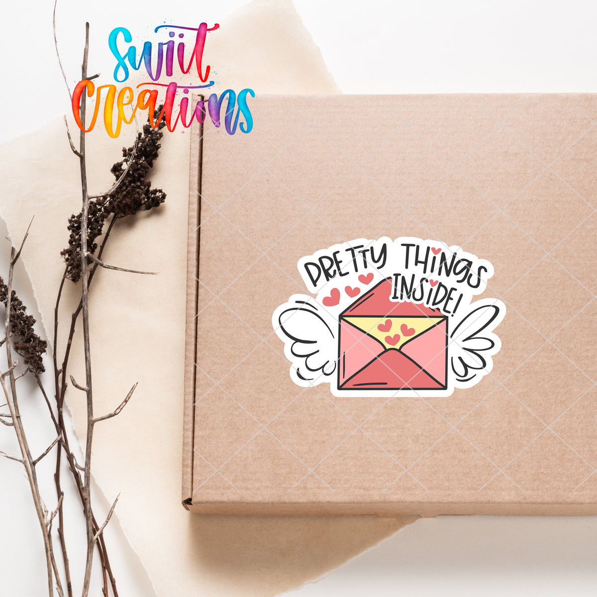 a box with a sticker on it sitting next to a plant