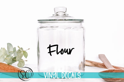 a glass jar with the word flour written on it