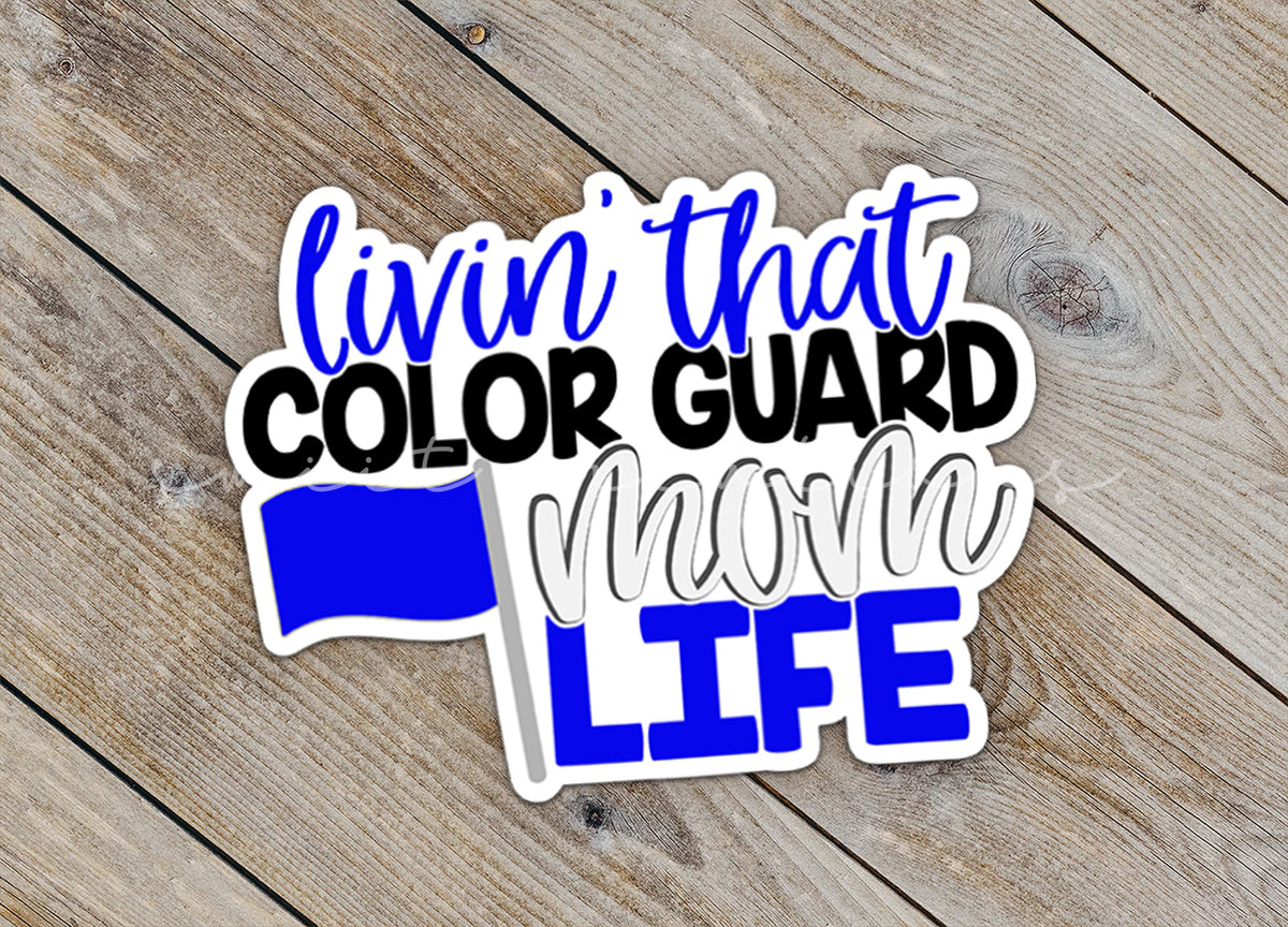 Close-up of the Livin' That Color Guard Mom Life sticker on rustic wood