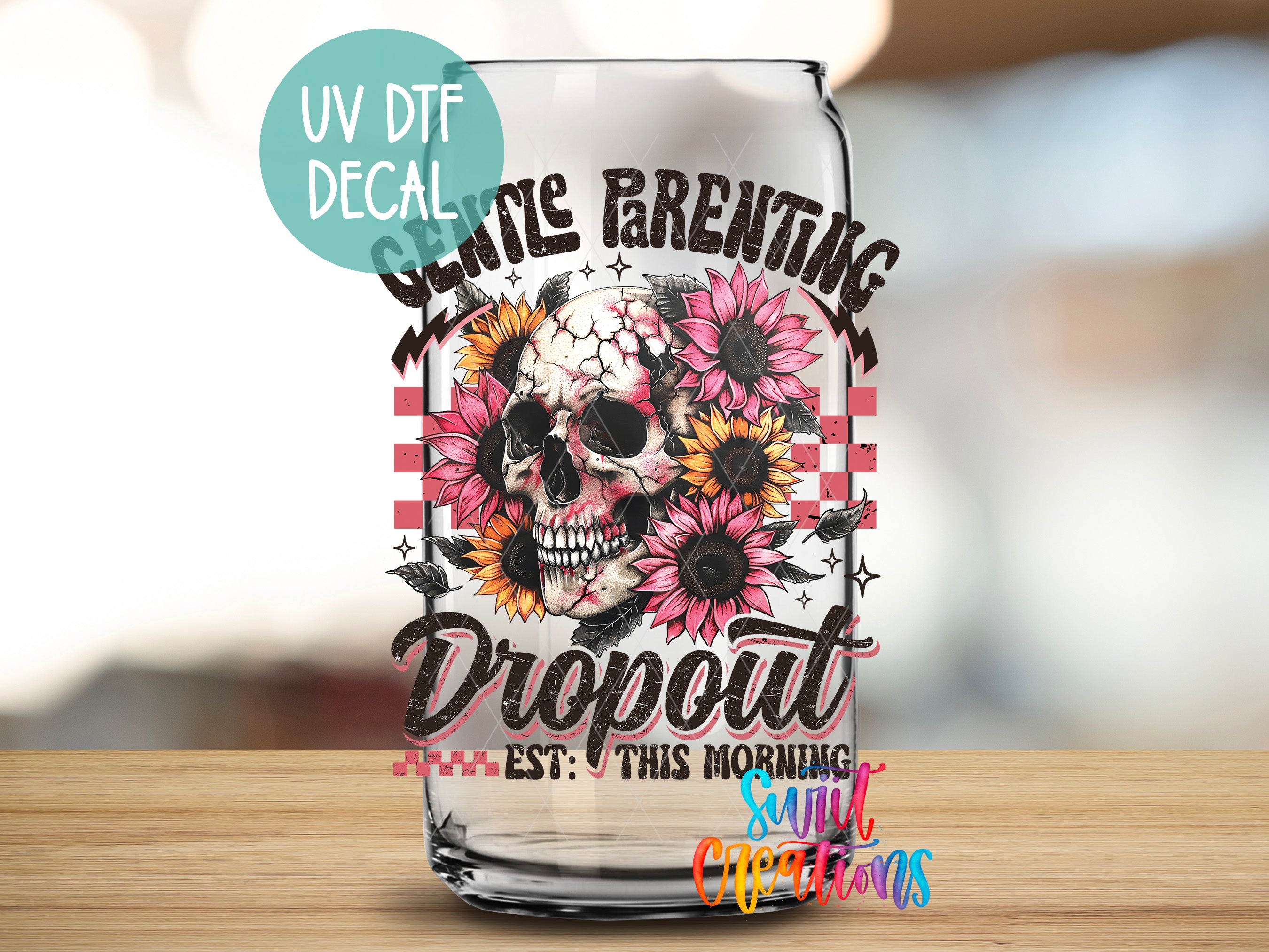 a glass with a skull and flowers on it