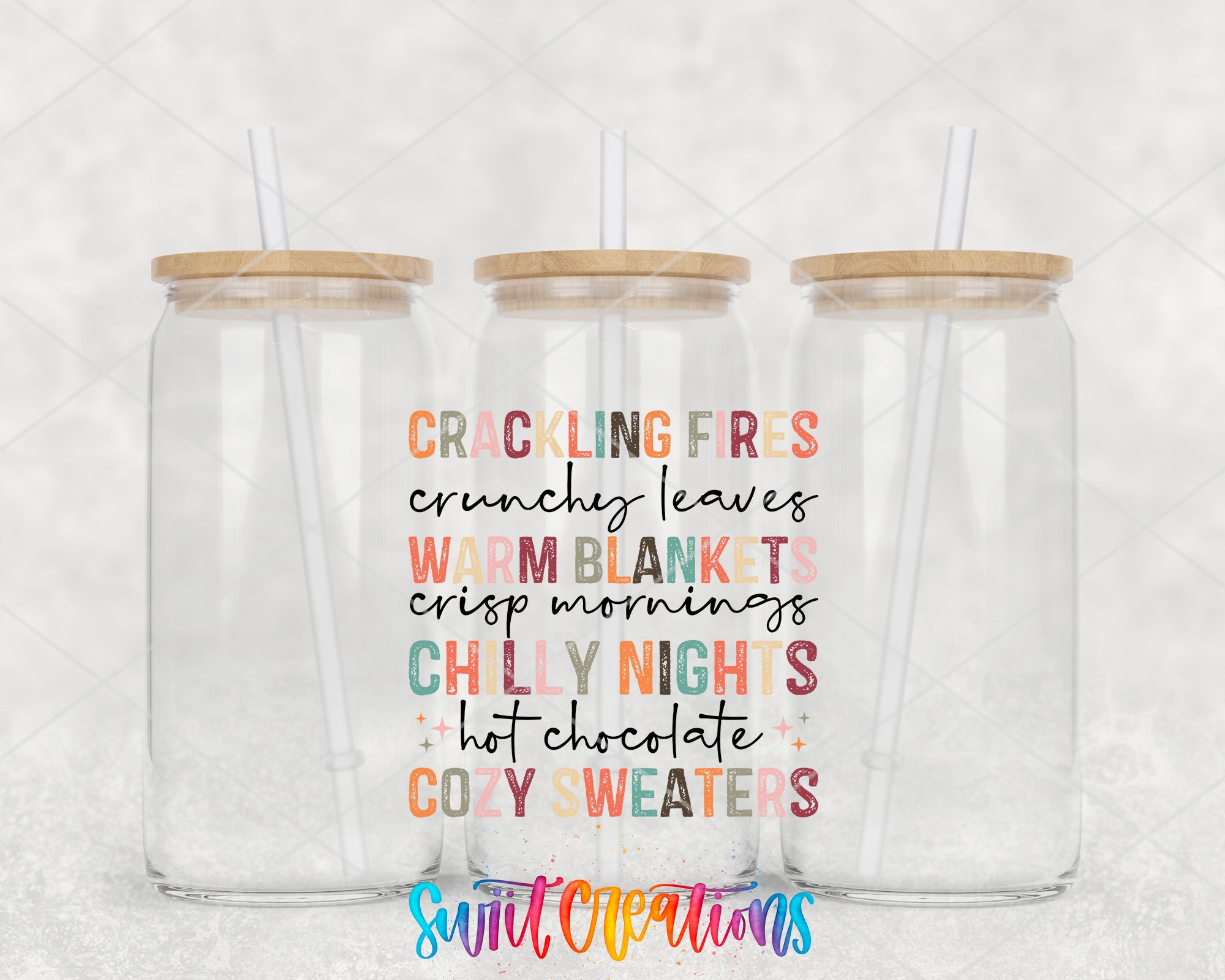 two clear tumblers with wooden lids and straws on a white background