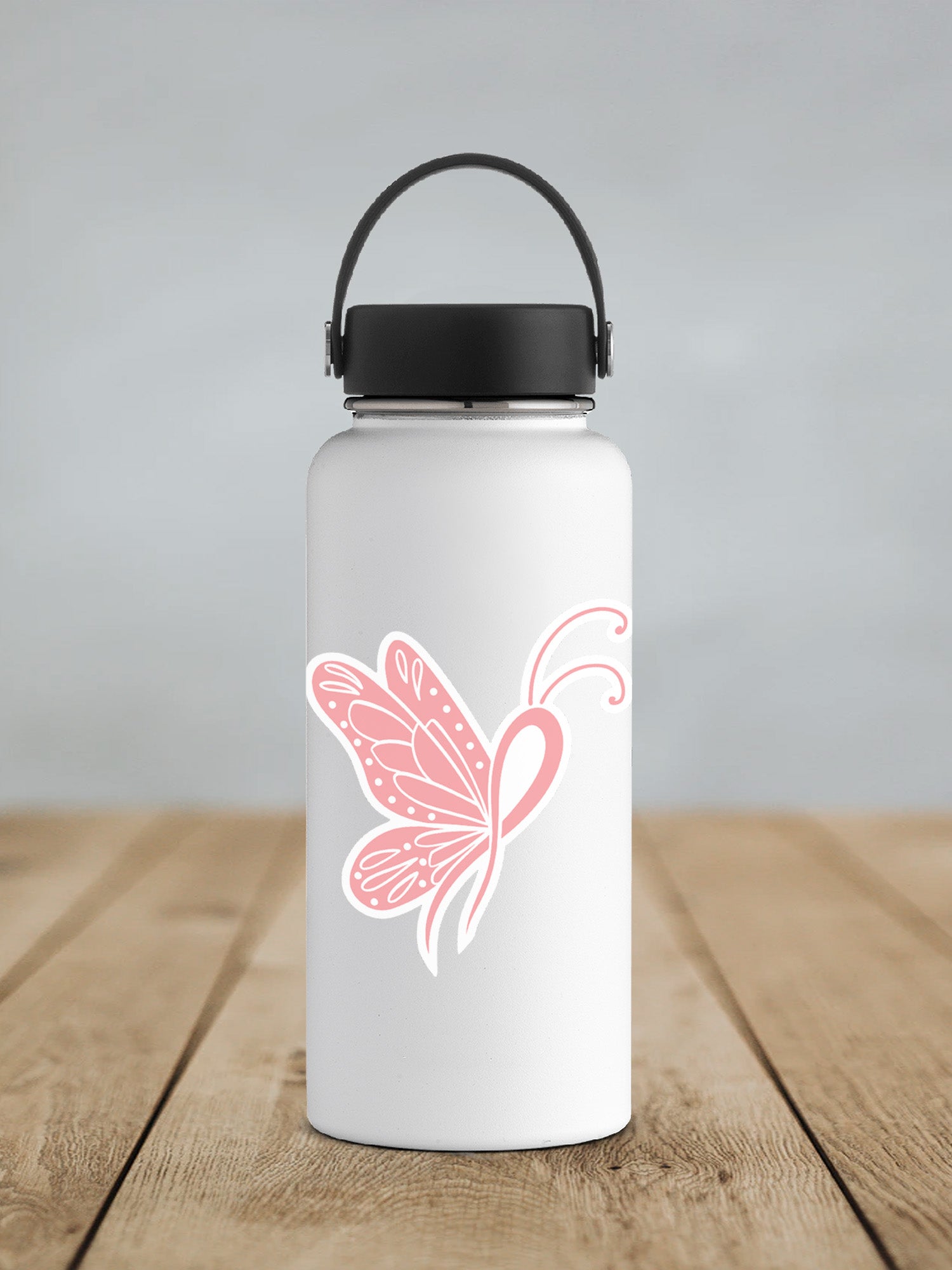 a white water bottle with a pink butterfly on it