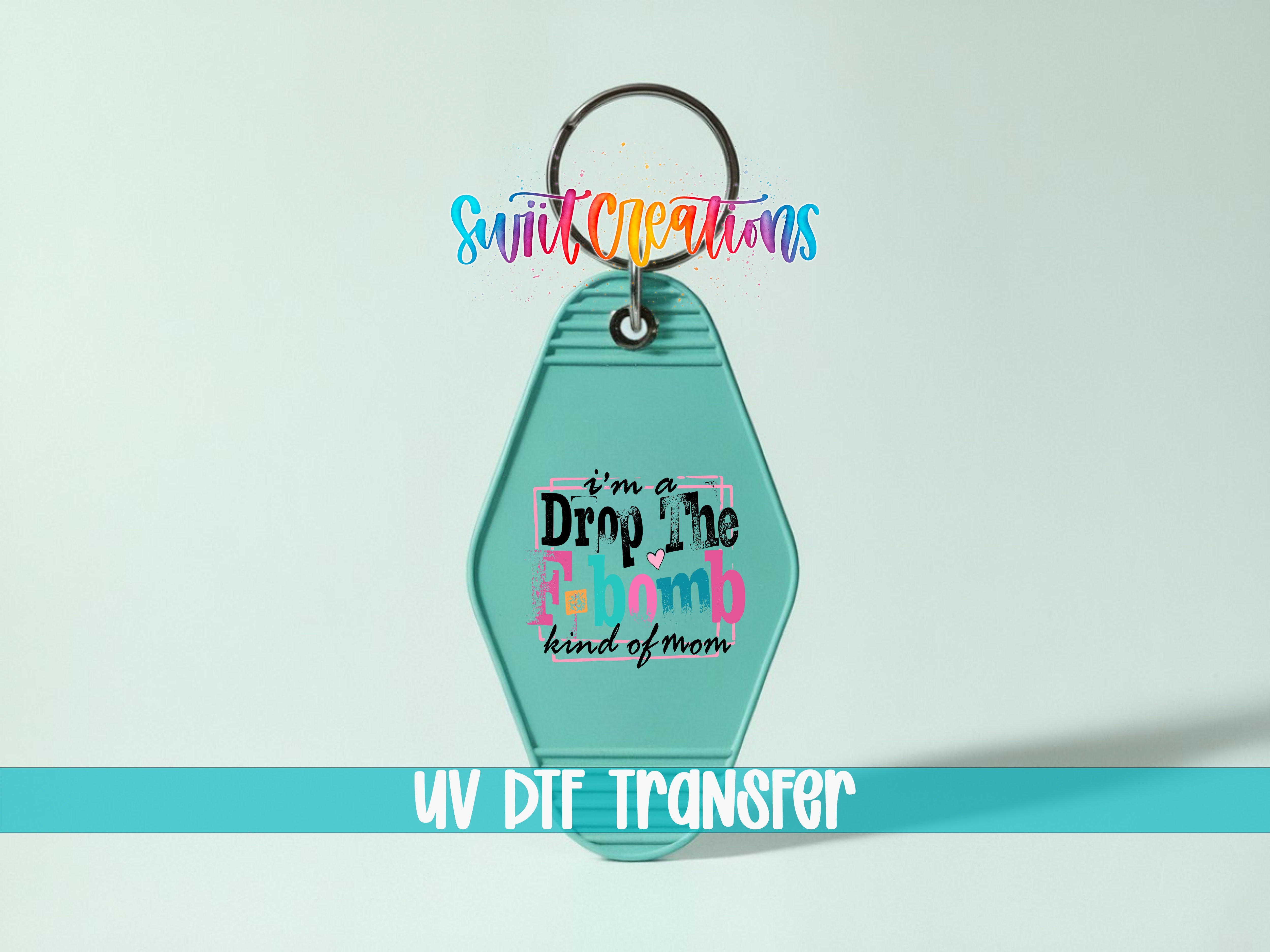 A keychain with a colorful design and text on it, along with a UV DIF Transfer label.