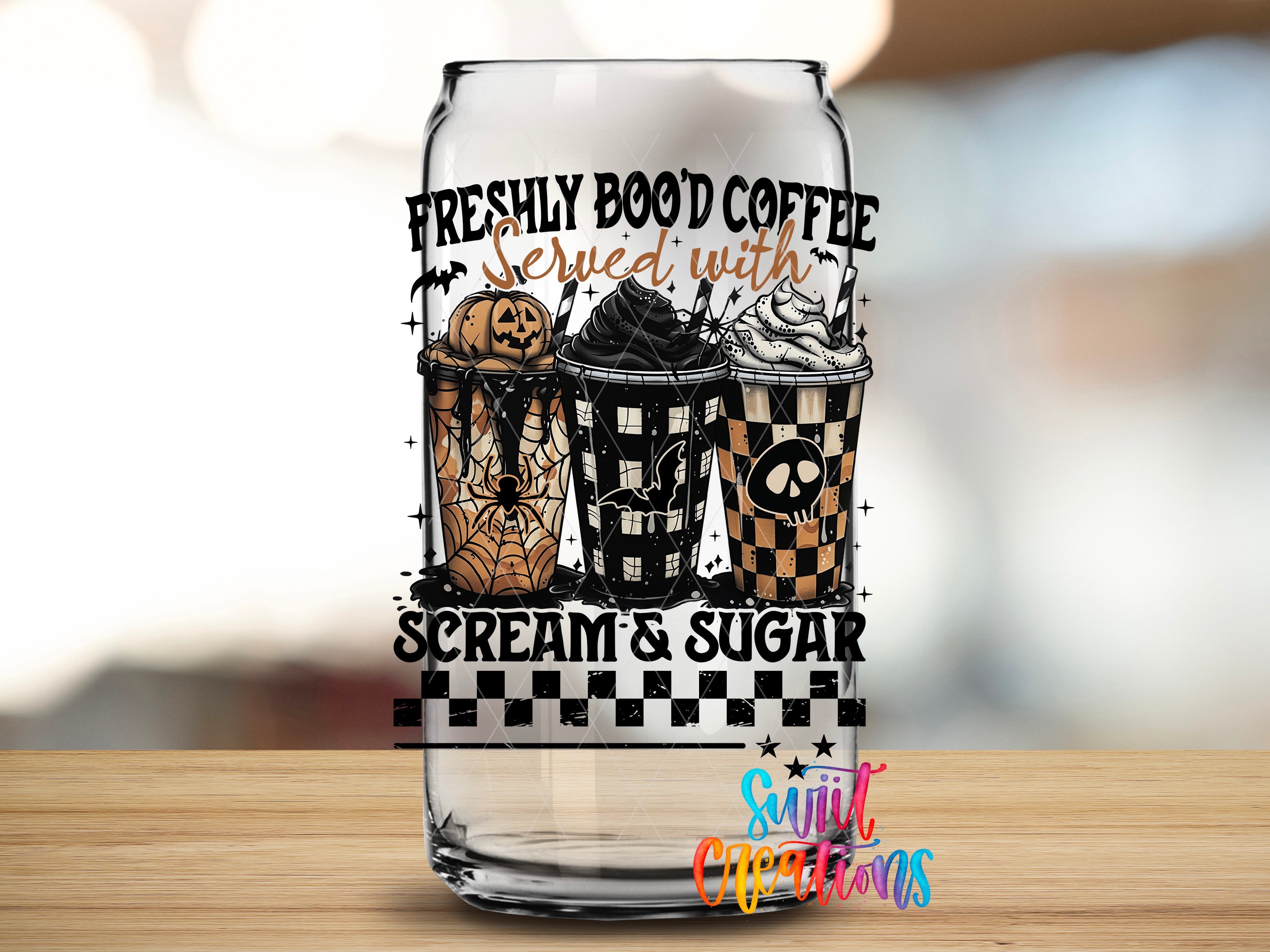 A glass can with a Halloween-themed design featuring a pumpkin, spider, and a cup of coffee with whipped cream and a skull.