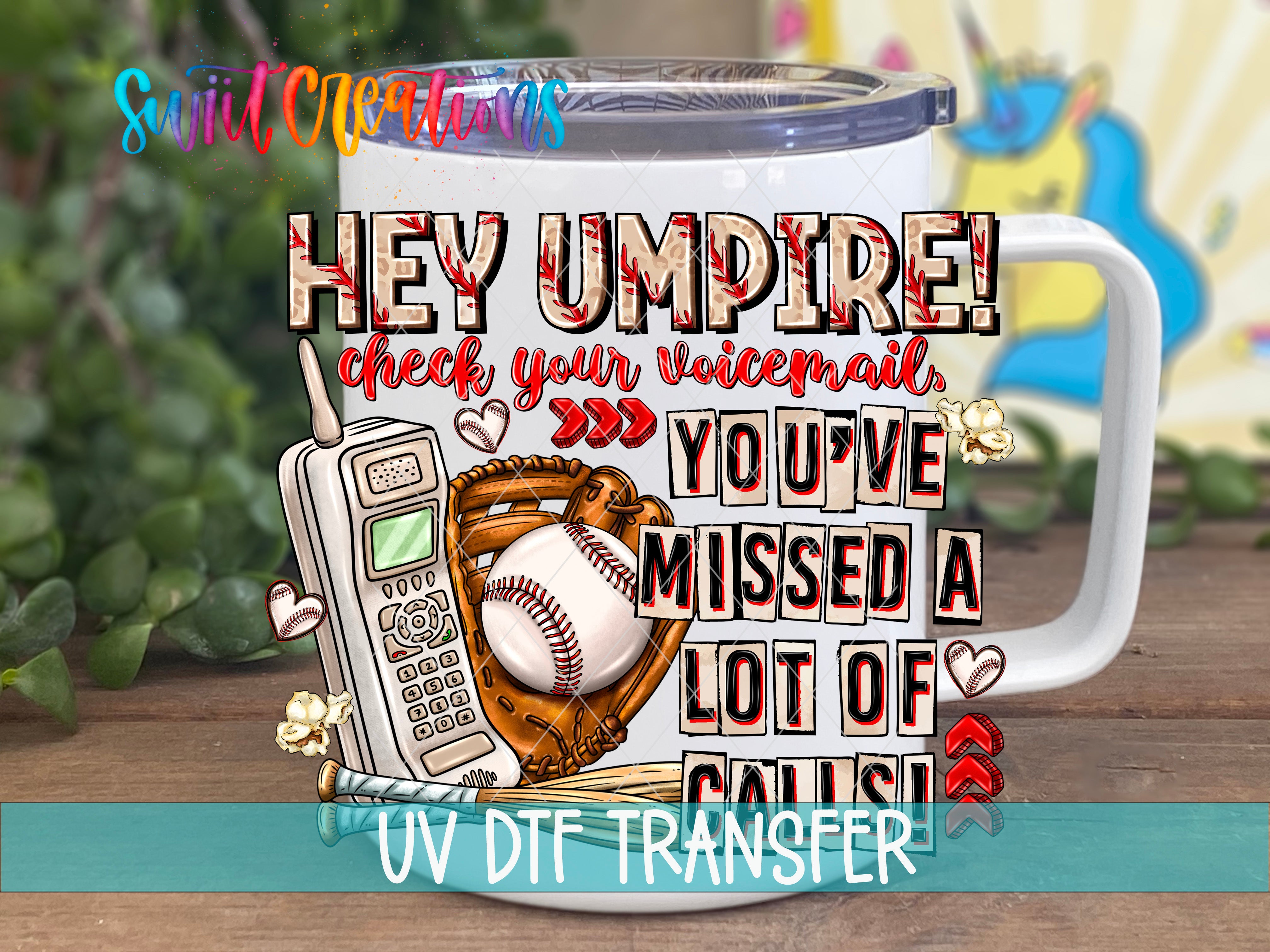 a mug with a humorous text and various objects, including a baseball glove, a phone, and a baseball, all arranged on a wooden surface.
