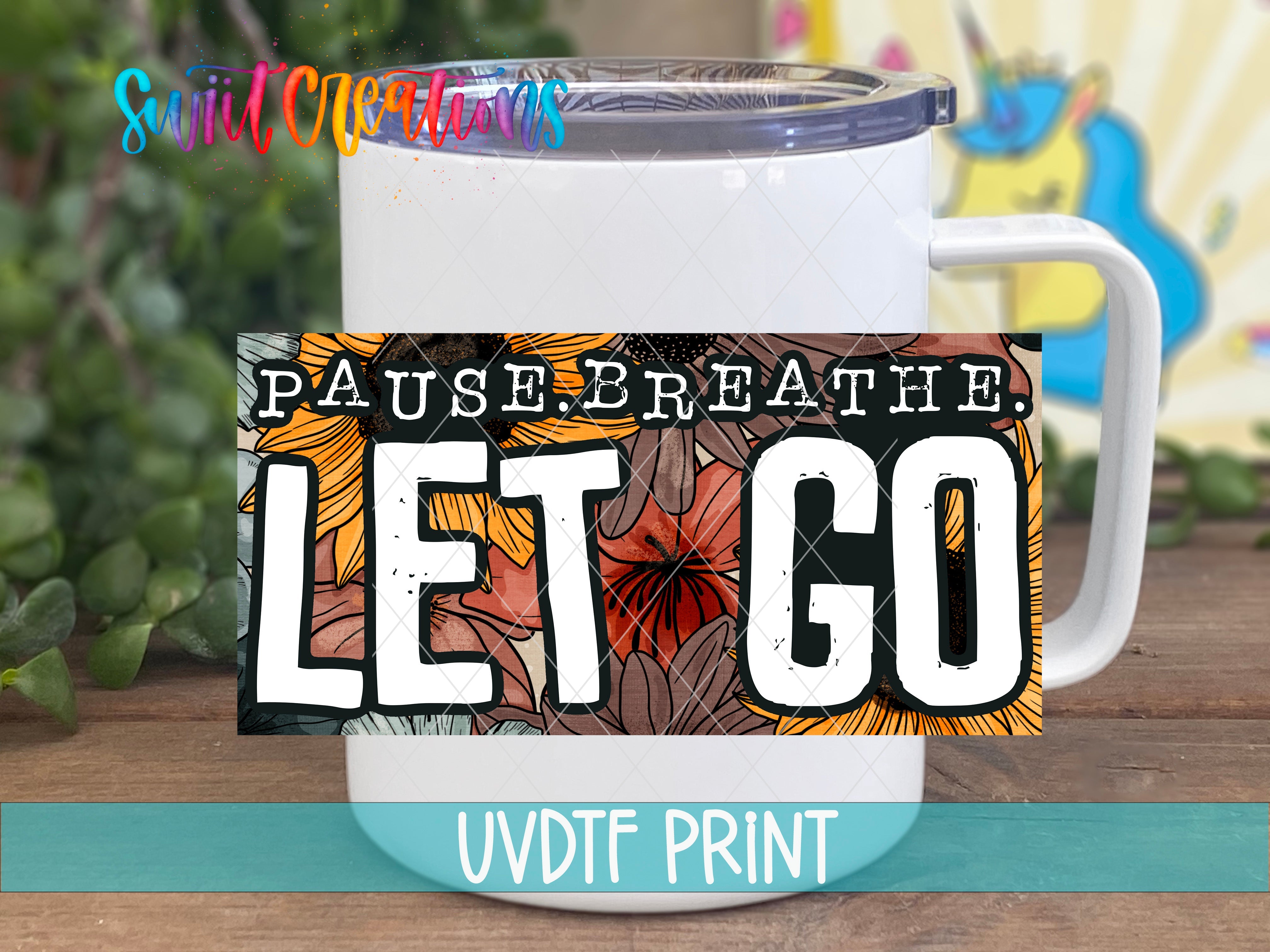 a white coffee mug with the words let go on it