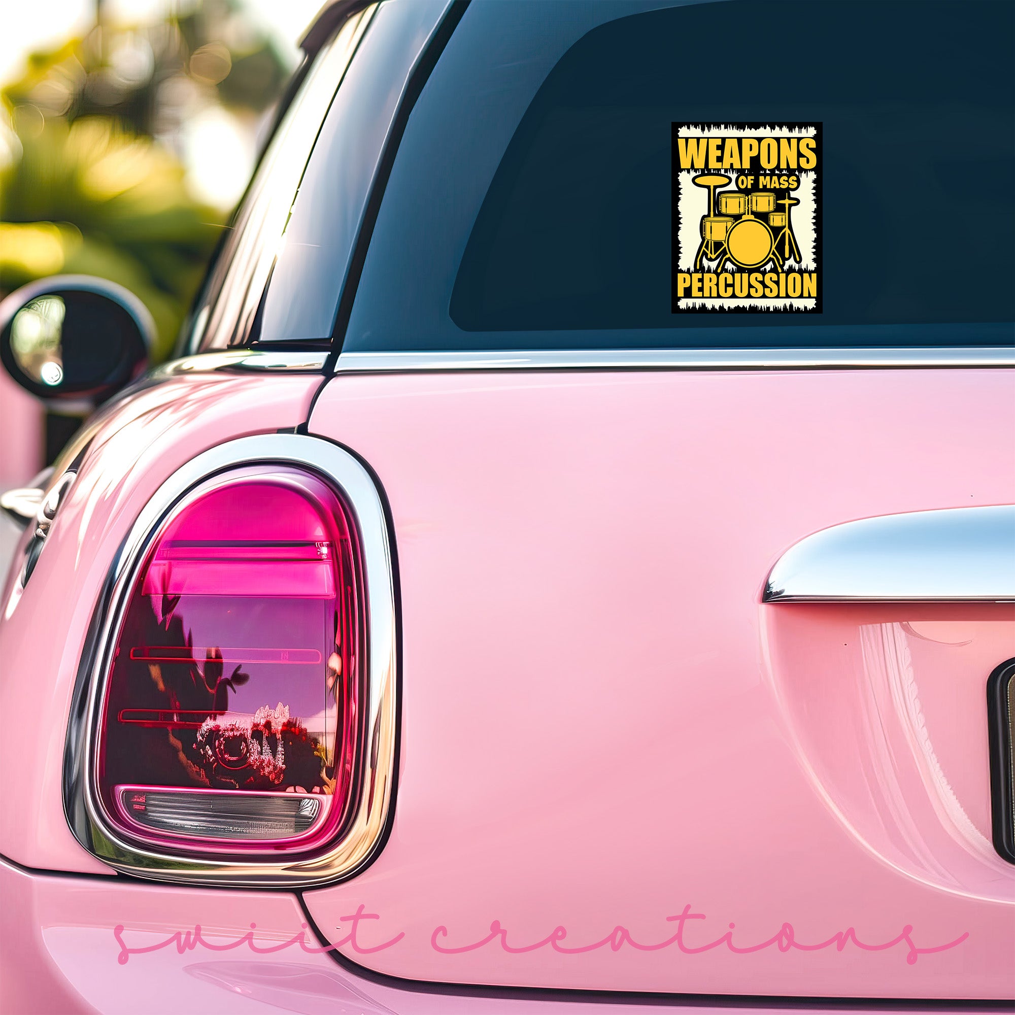a pink car with a sticker on it