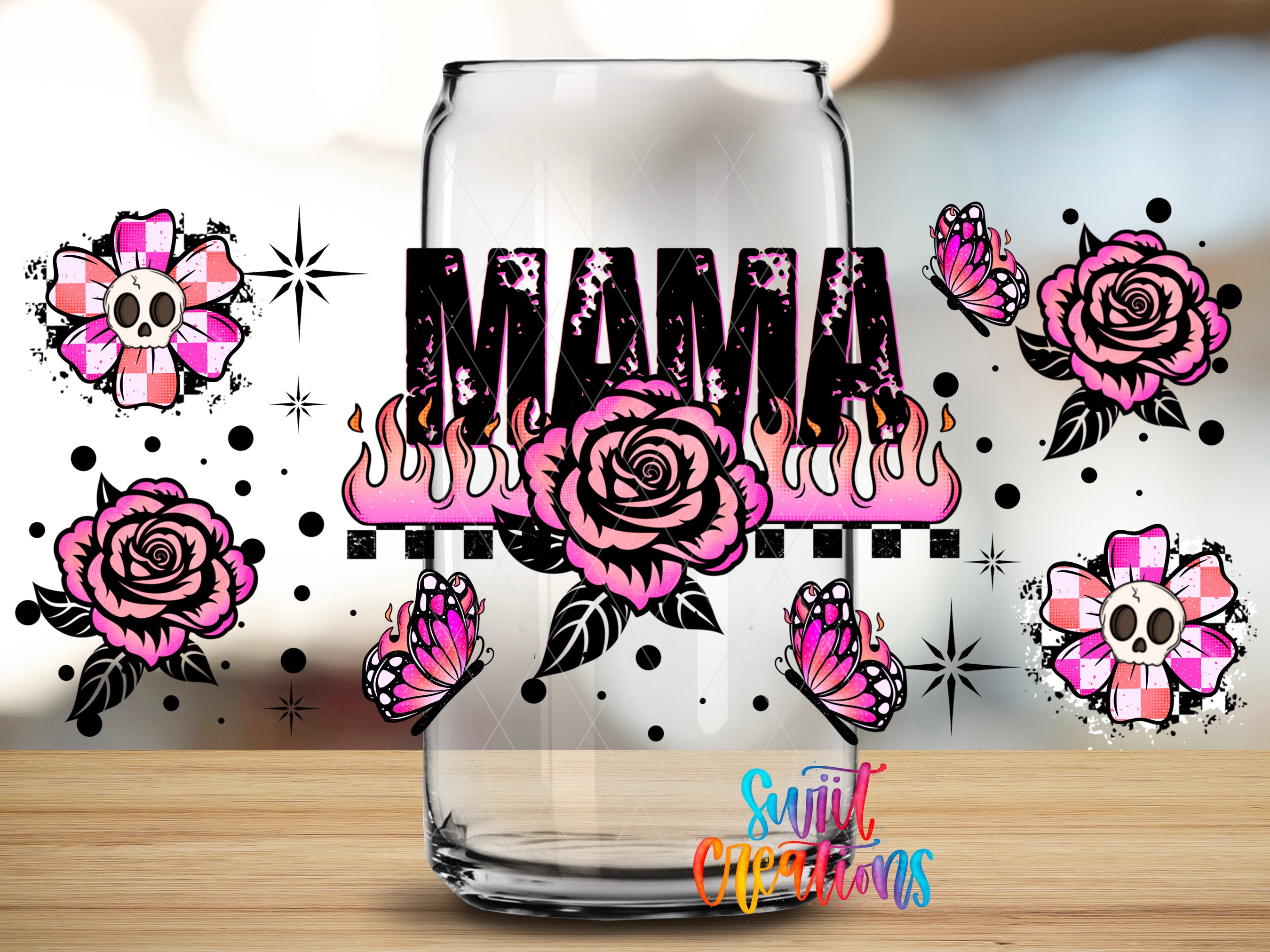 a glass with the word "MAMA" written on it, surrounded by various floral and butterfly designs in pink and black.