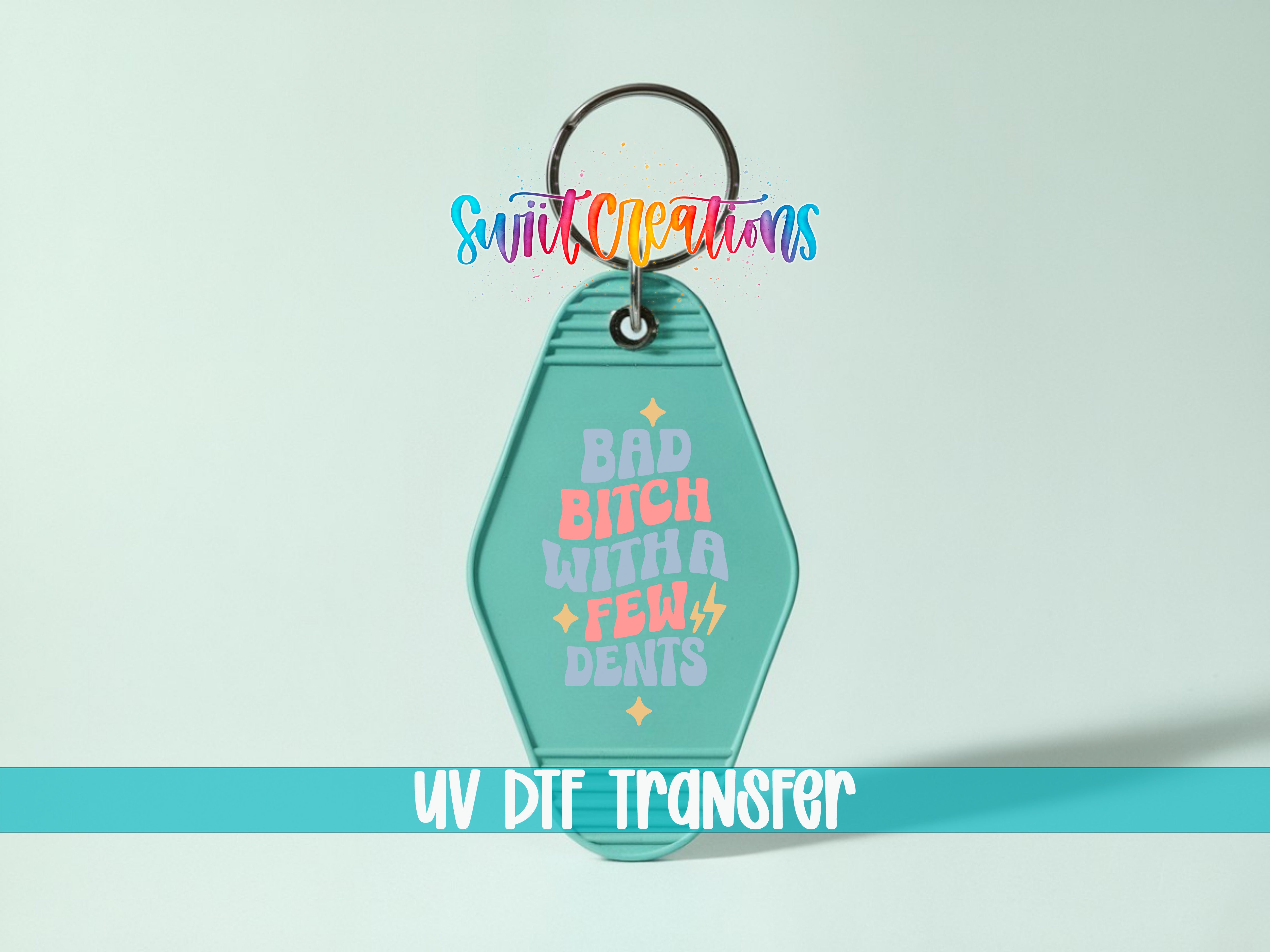 A keychain with a colorful design and text on it, along with a UV DIF Transfer label.
