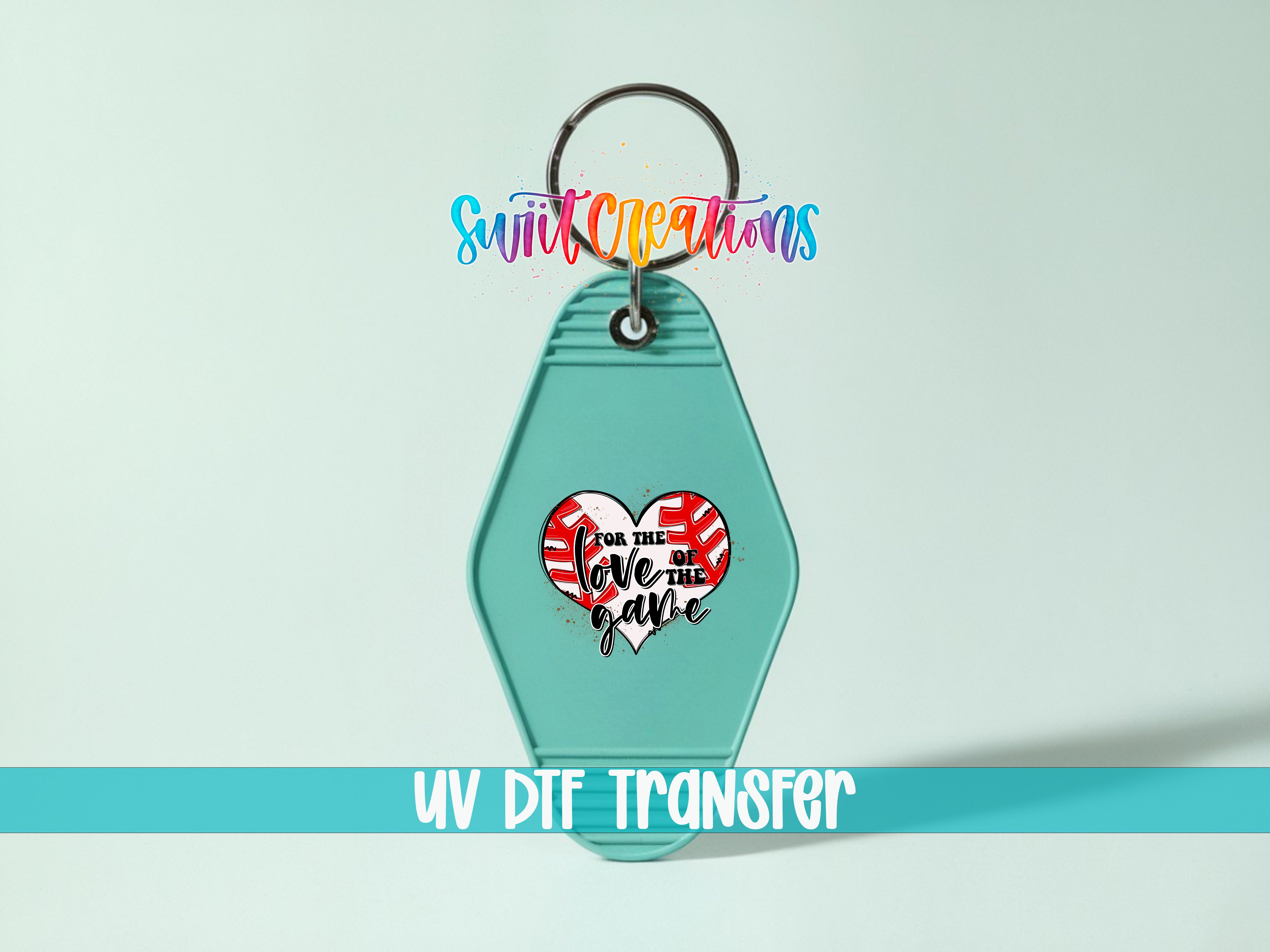 A turquoise keychain with a heart-shaped design and text on it, along with a rainbow-colored text logo above it.
