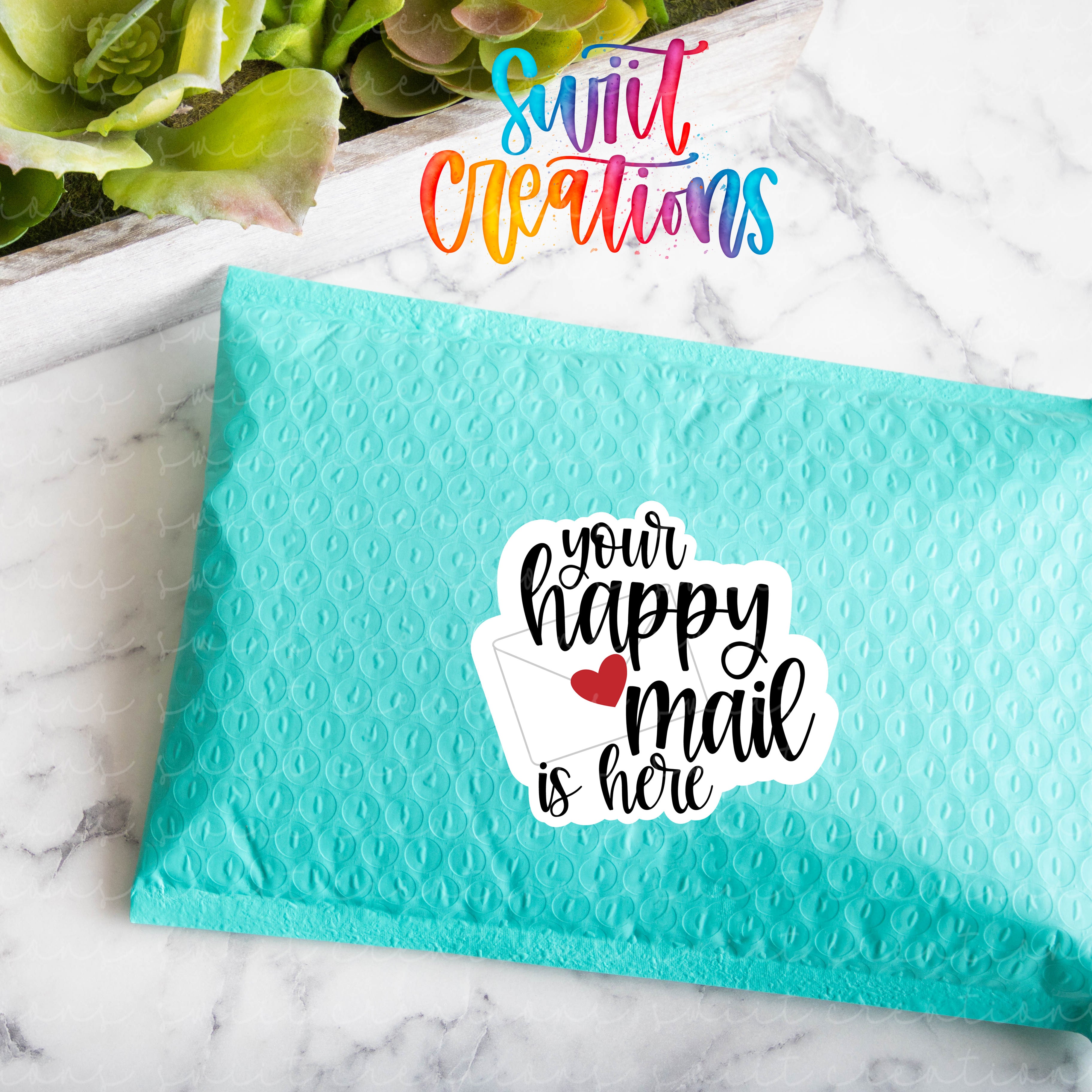 a blue envelope with a sticker saying your happy mail is here