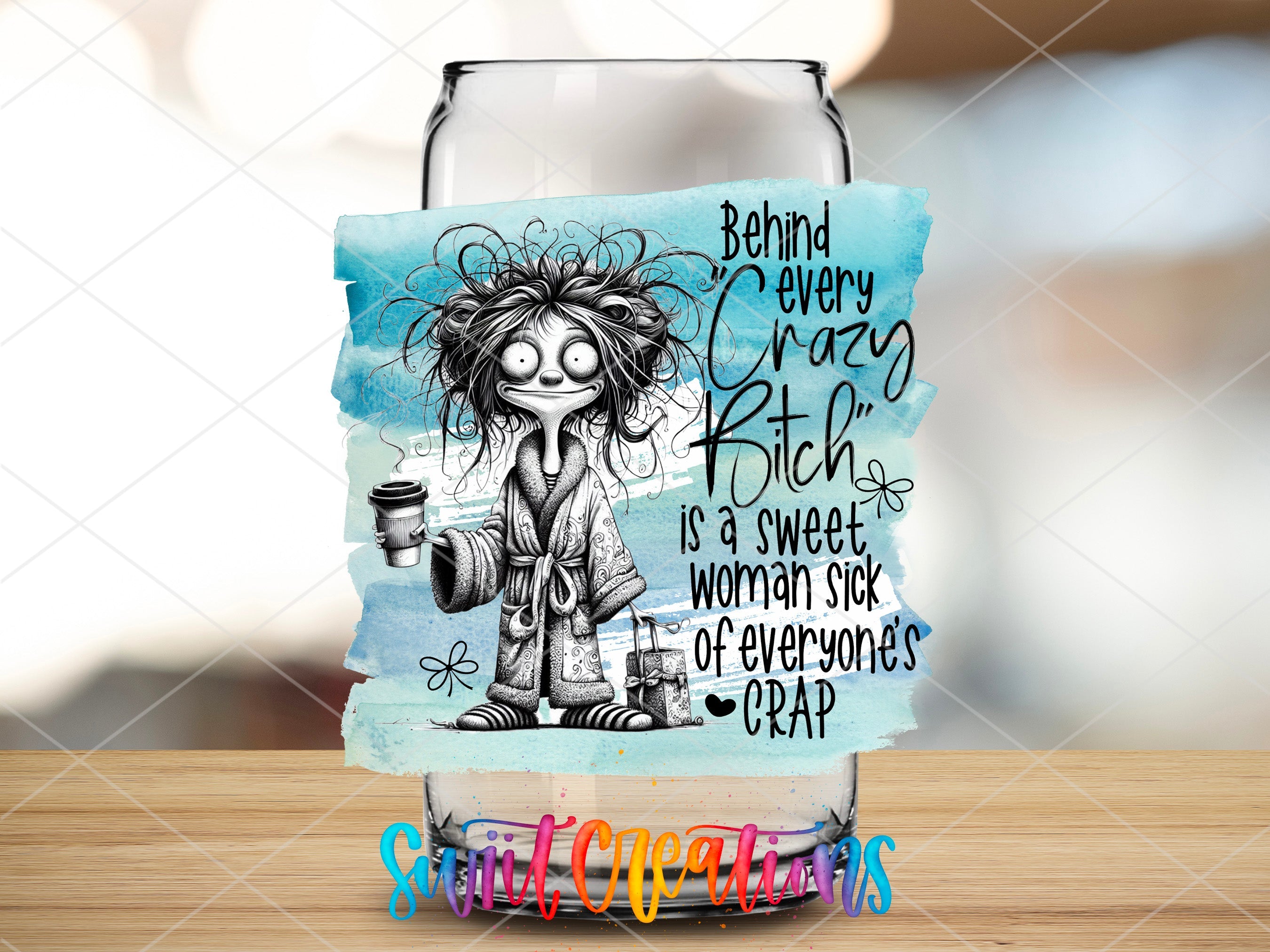 a glass with a picture of a woman holding a cup